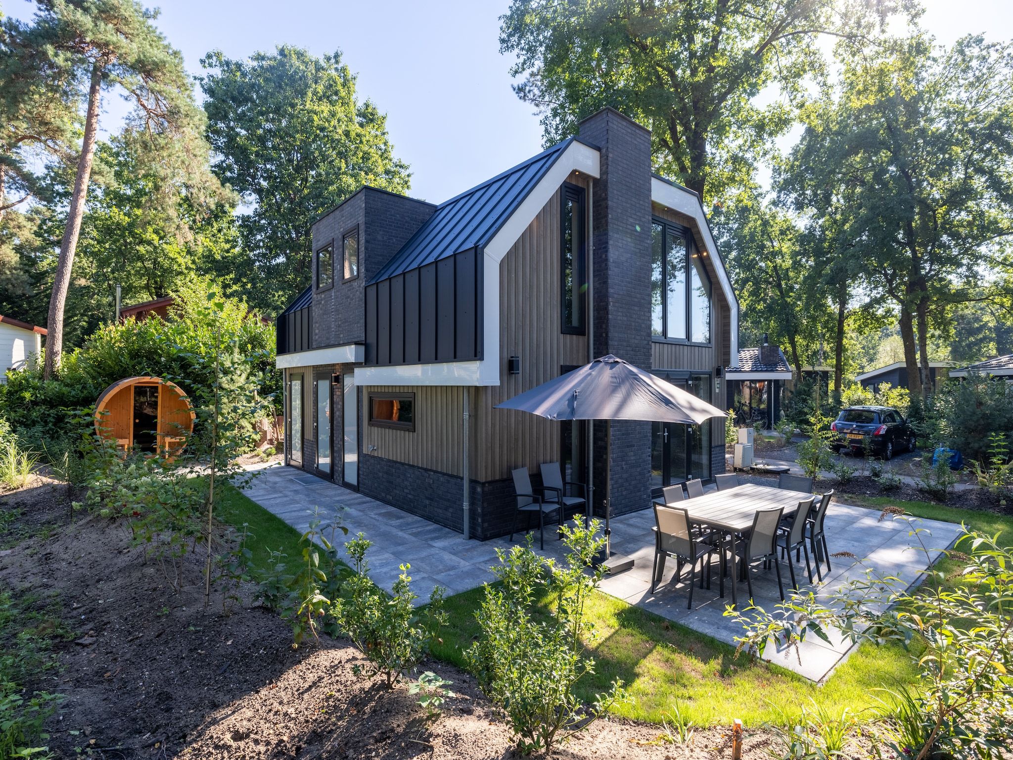 De tuin van Vakantiepark De Rimboe & De Woeste Hoogte 38 in Hoenderloo