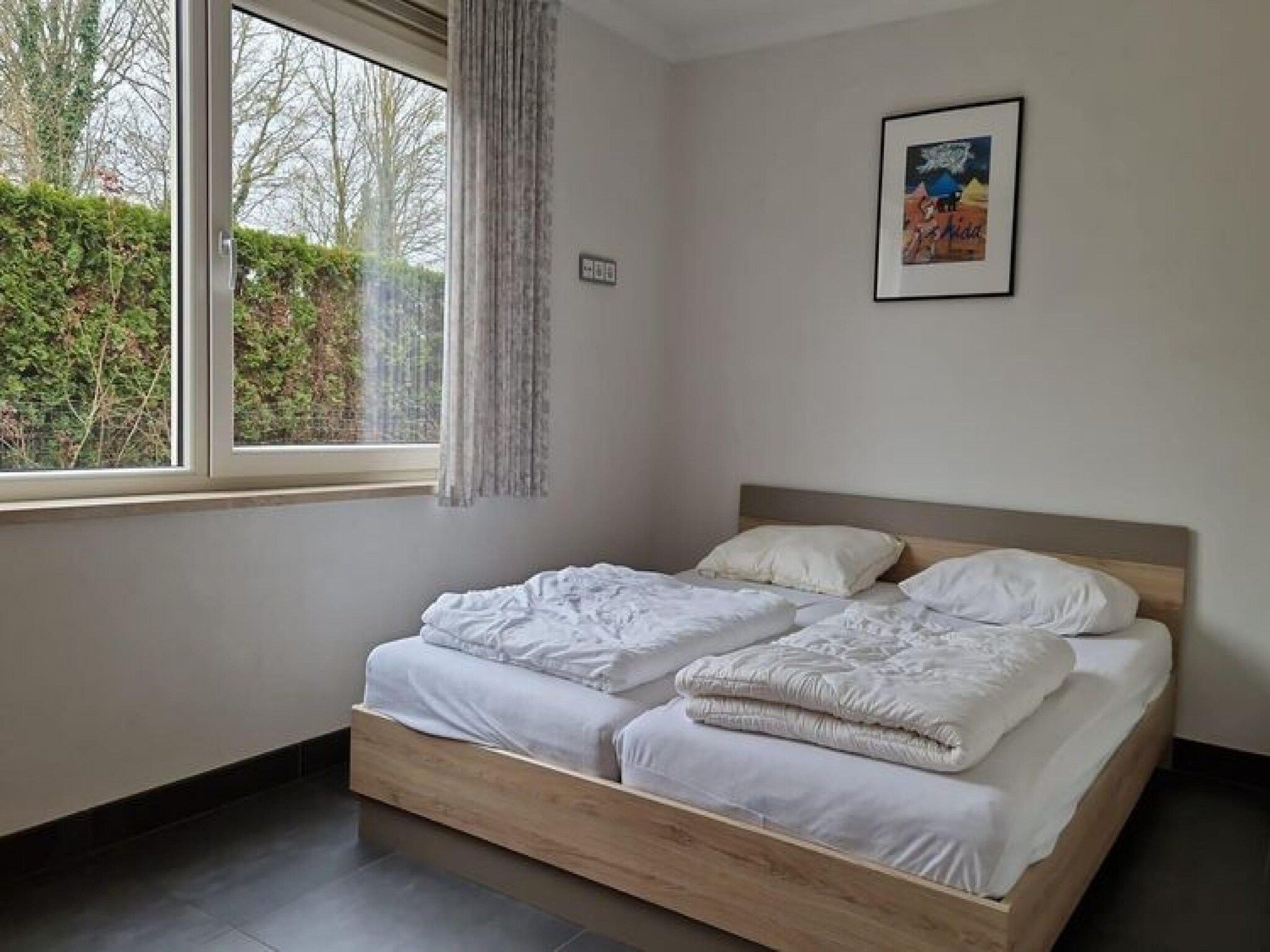 Een slaapkamer van Strandwoning Baarland in Zeeland in Baarland