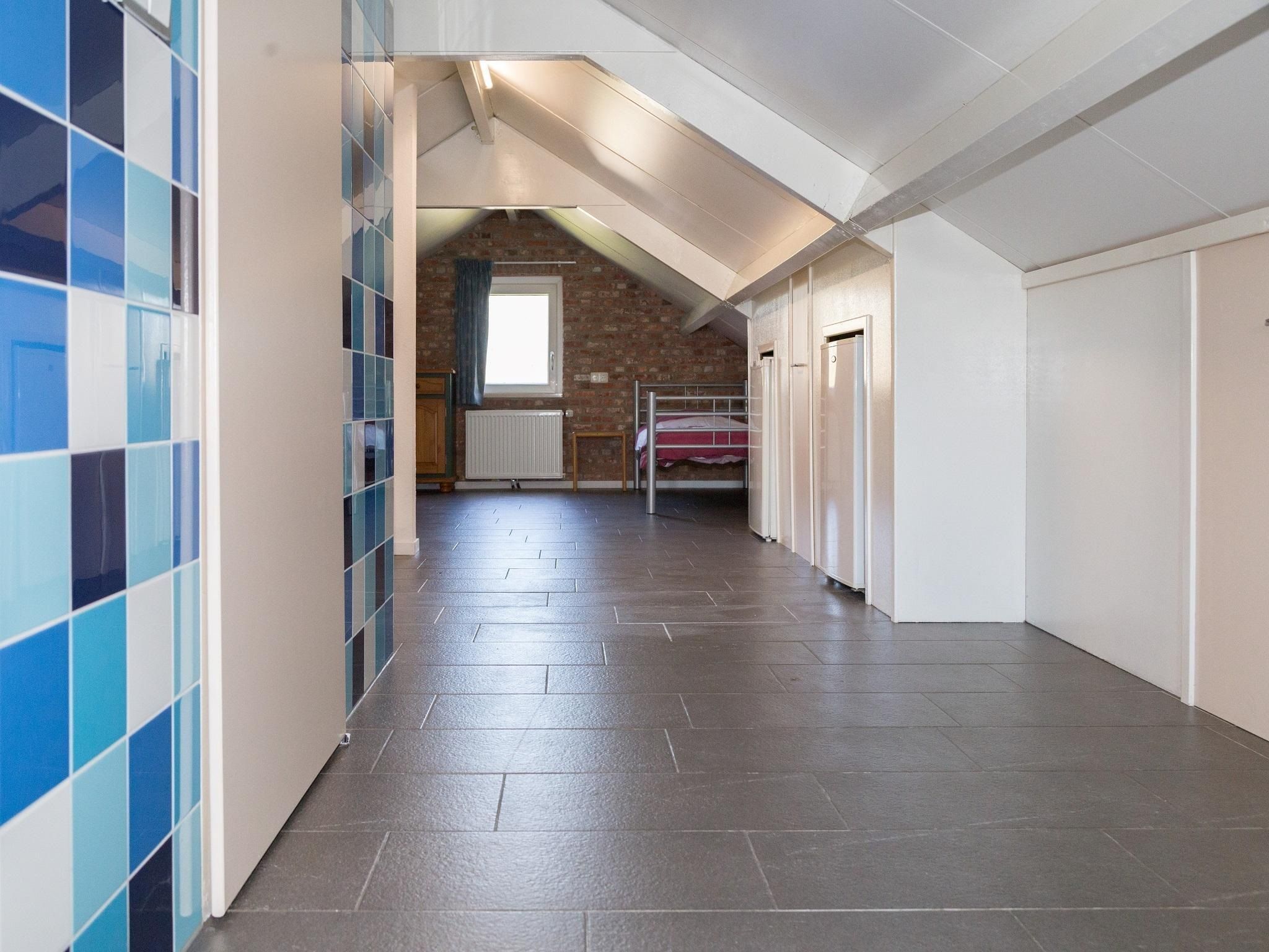Een slaapkamer van Strandwoning Baarland in Zeeland in Baarland