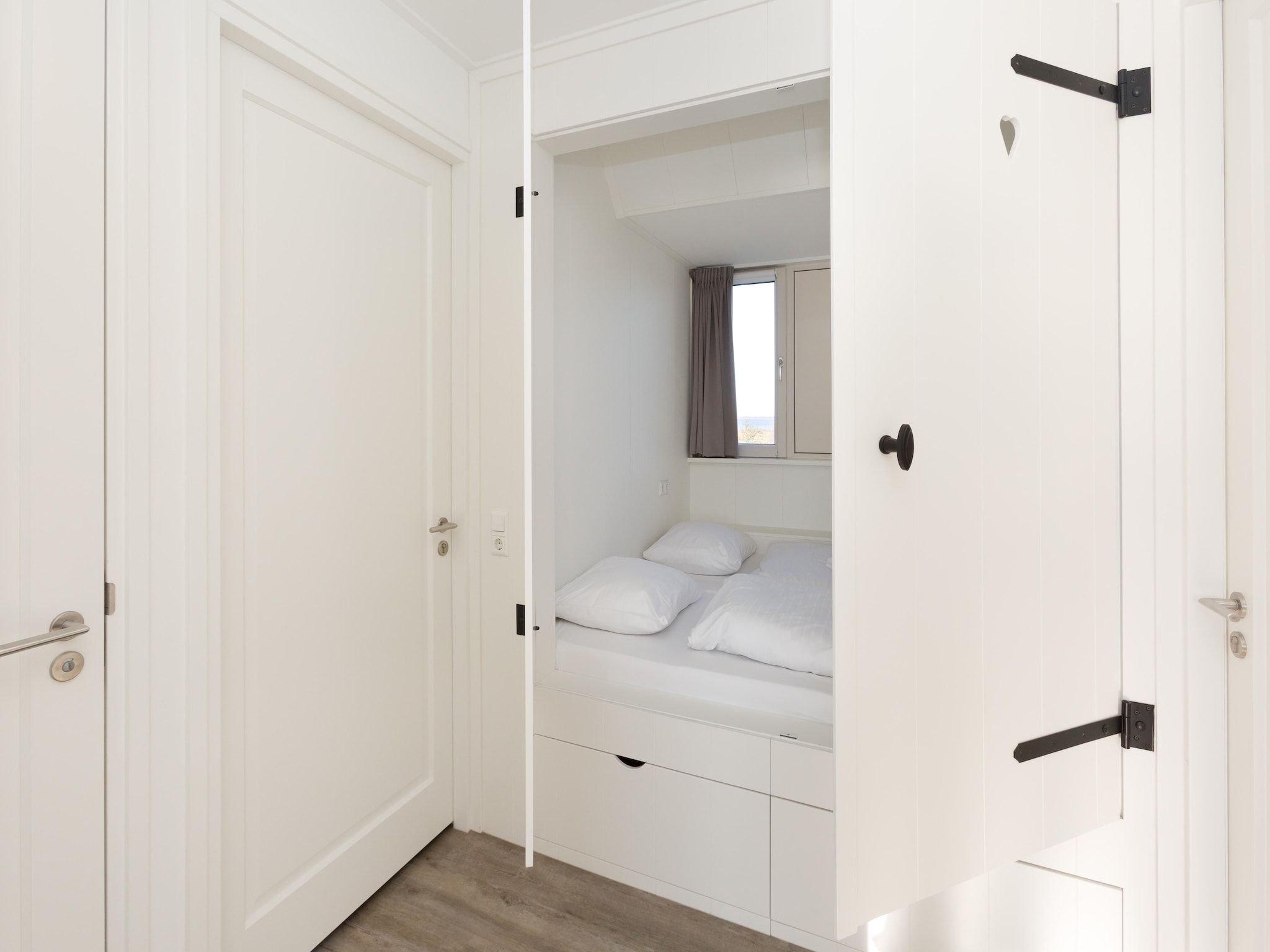 Een slaapkamer van Friese Meren Villa's 18 in Delfstrahuizen