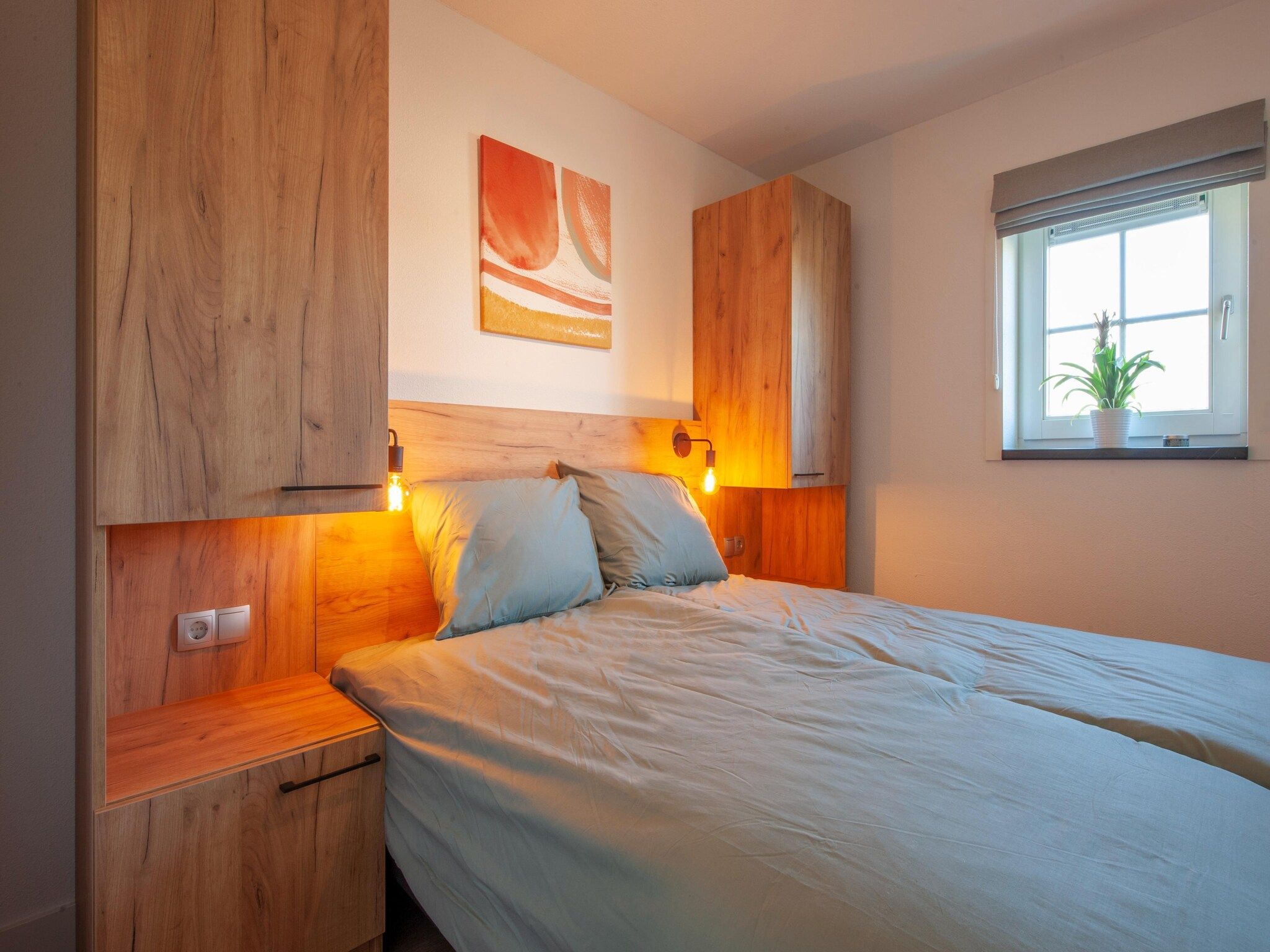 Een slaapkamer van Vakantiepark De Heihorsten 6 in Someren