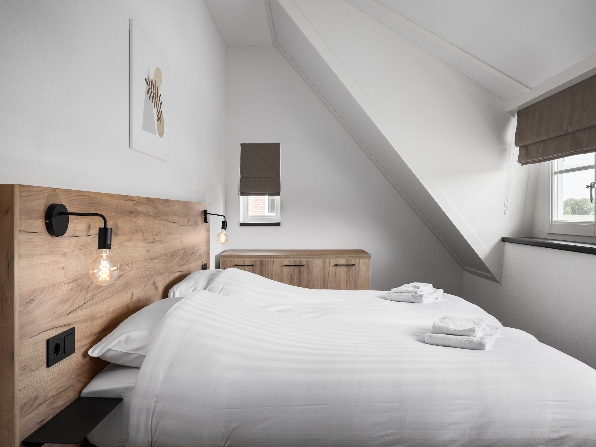 Een slaapkamer van Vakantiepark De Heihorsten 9 in Someren