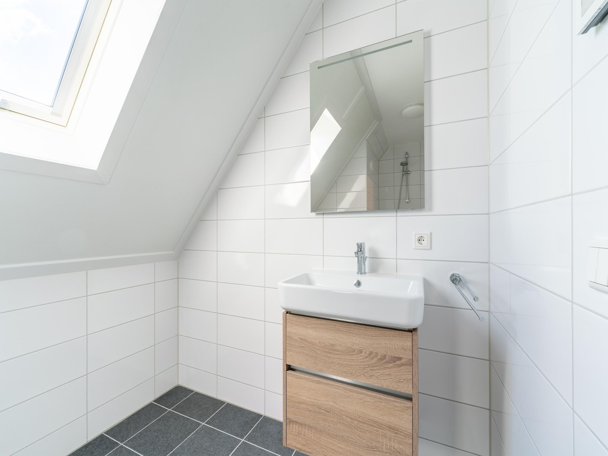 De badkamer van De Scholekster Huis Nr 29 in Scherpenisse