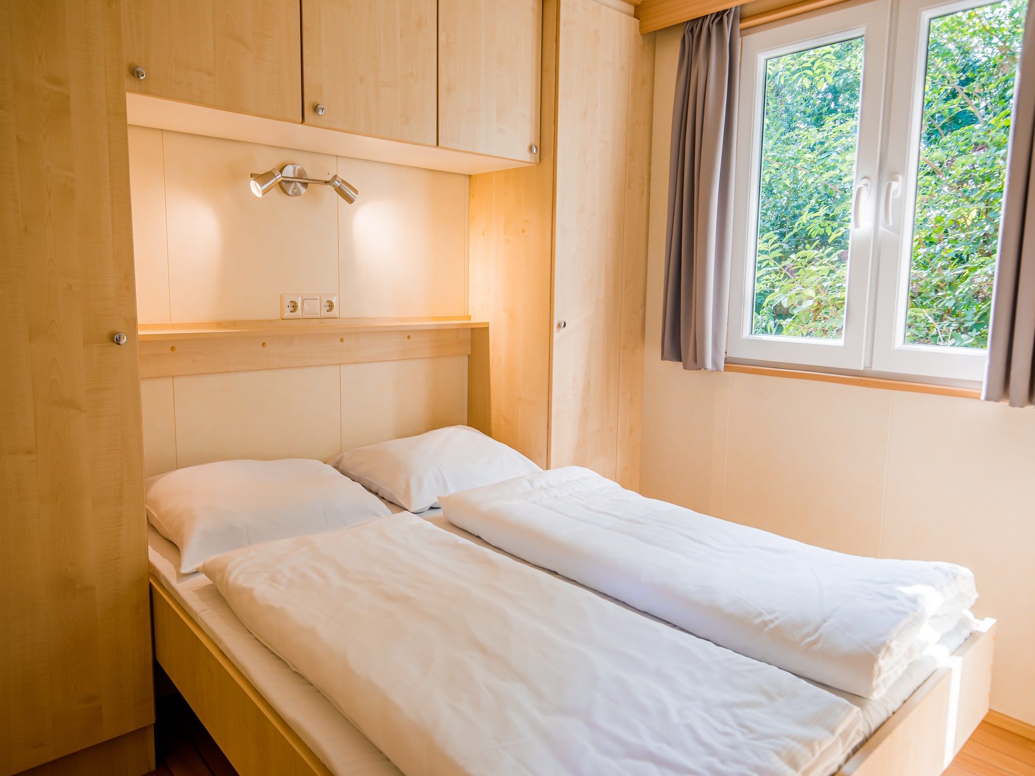Een slaapkamer van Vakantiepark Leukermeer 2 in Well