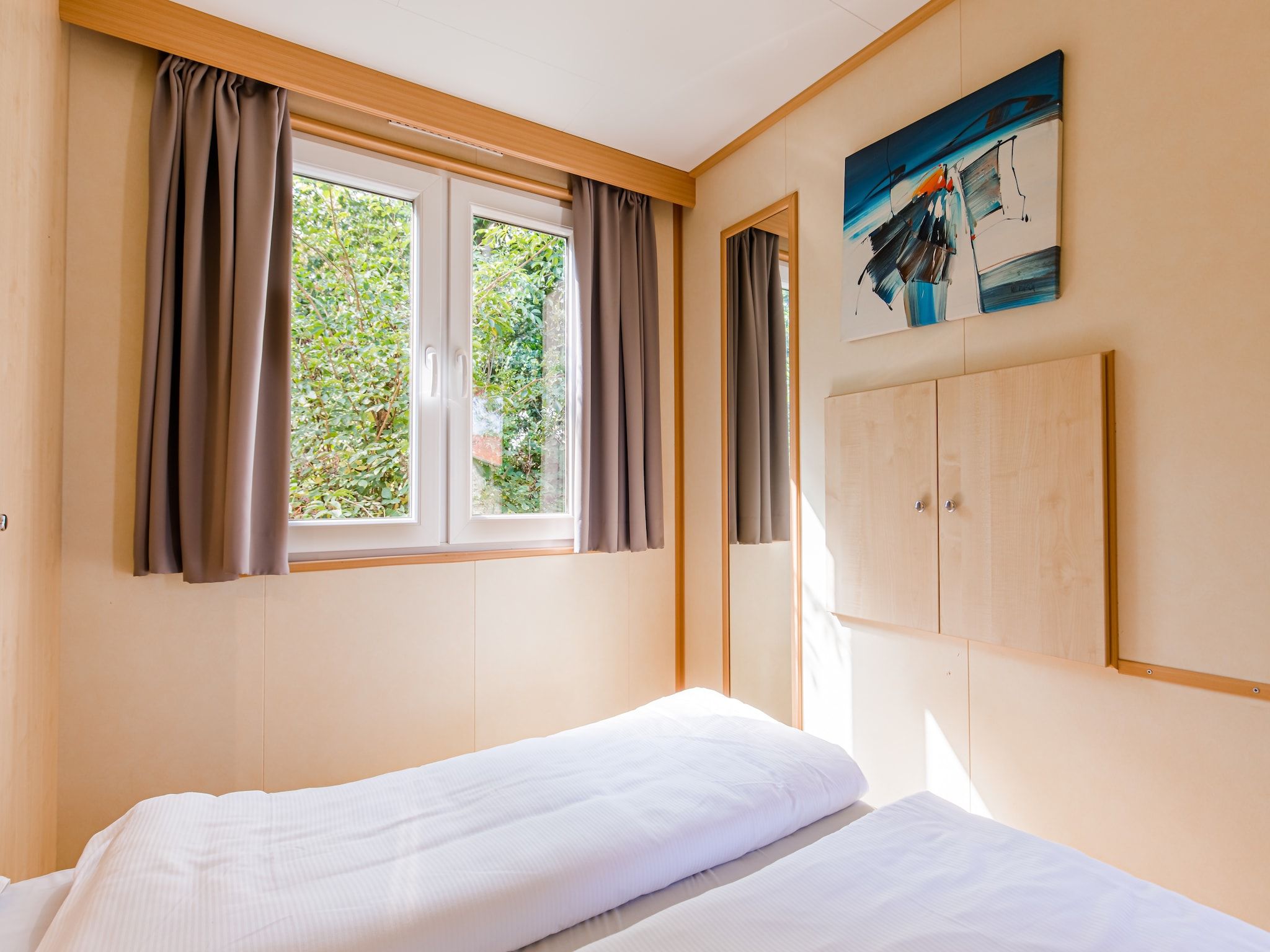 Een slaapkamer van Vakantiepark Leukermeer 2 in Well