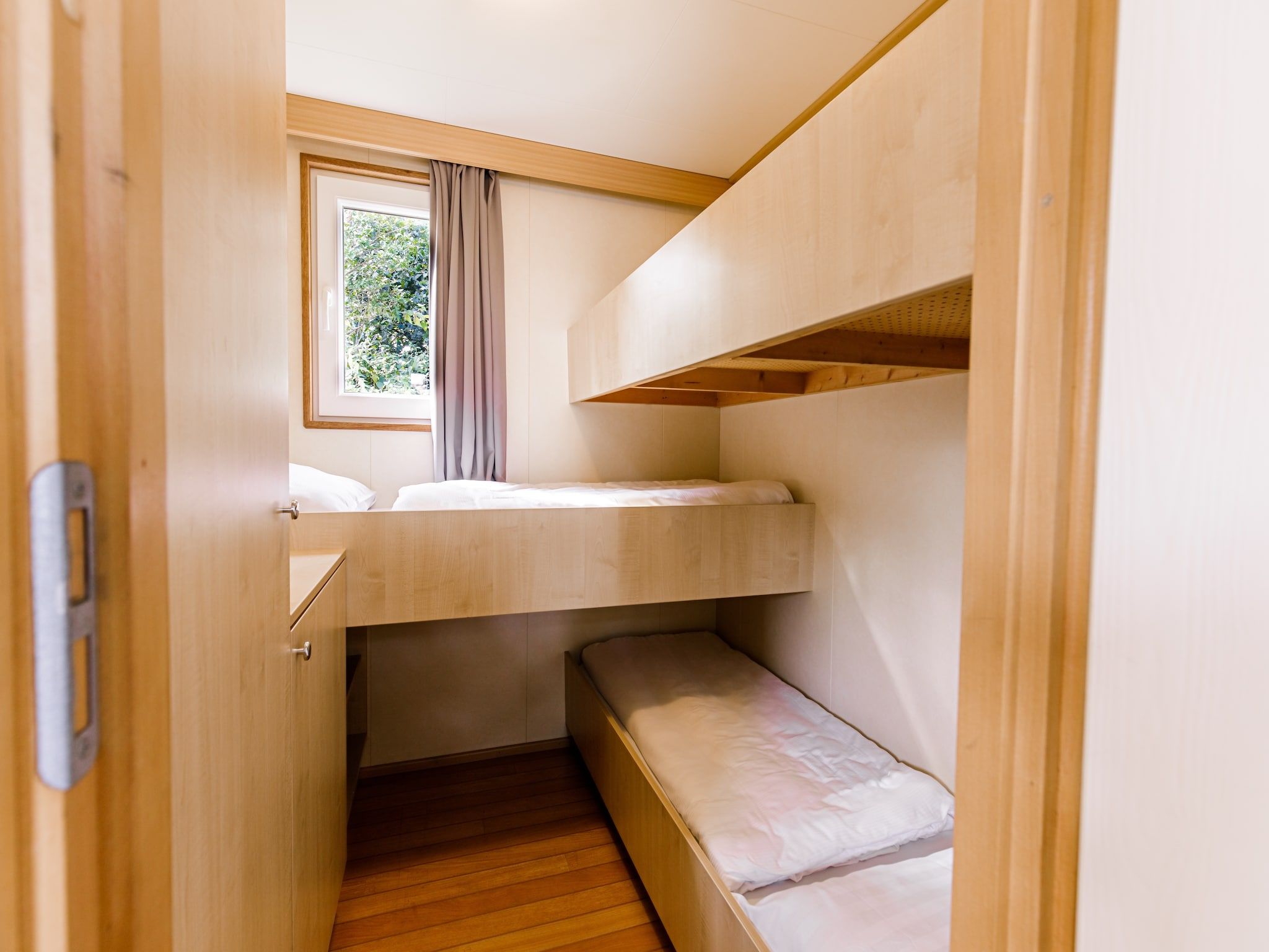 Een slaapkamer van Vakantiepark Leukermeer 6 in Well