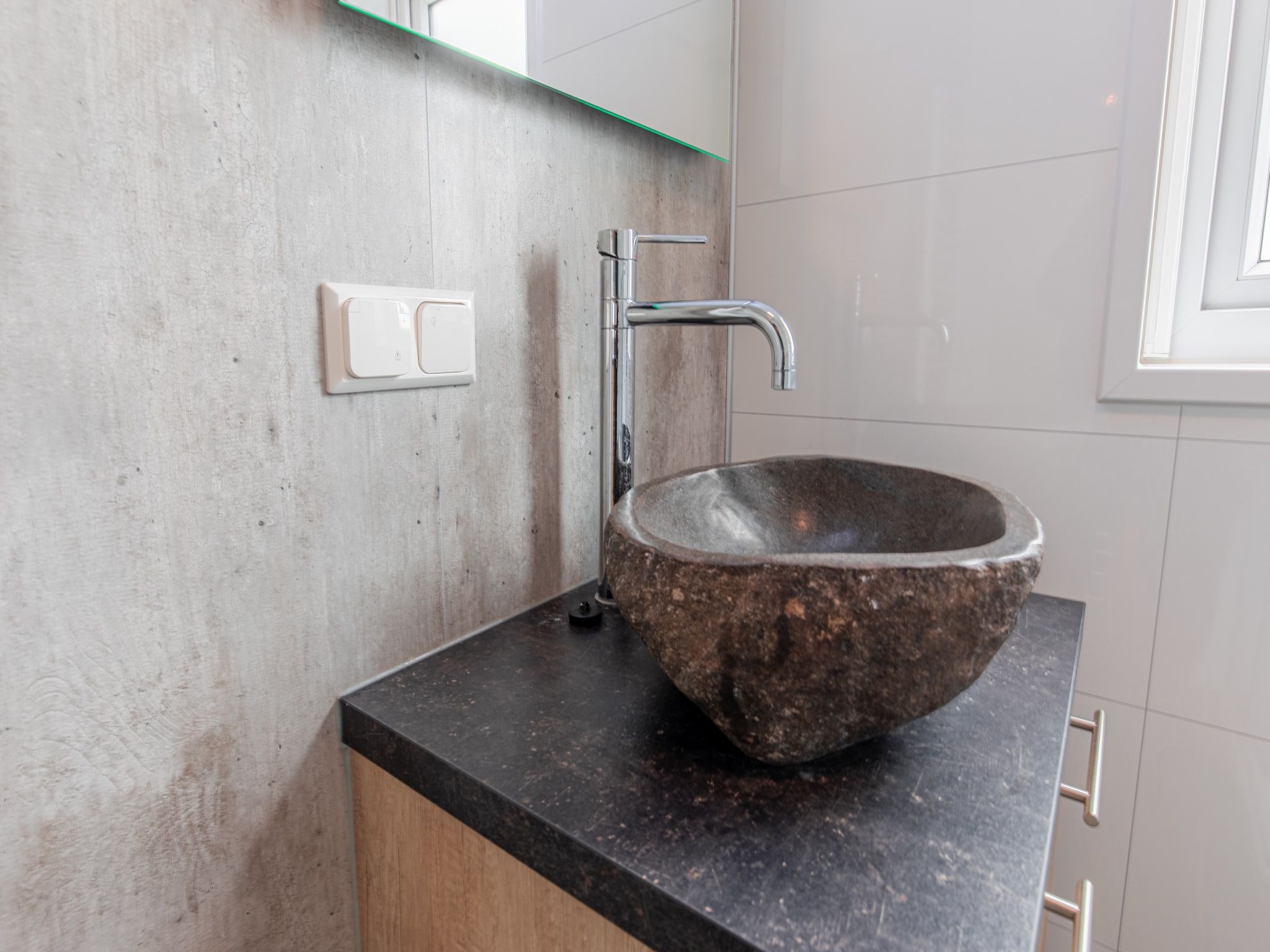 De badkamer van Vakantiepark Leukermeer 9 in Well