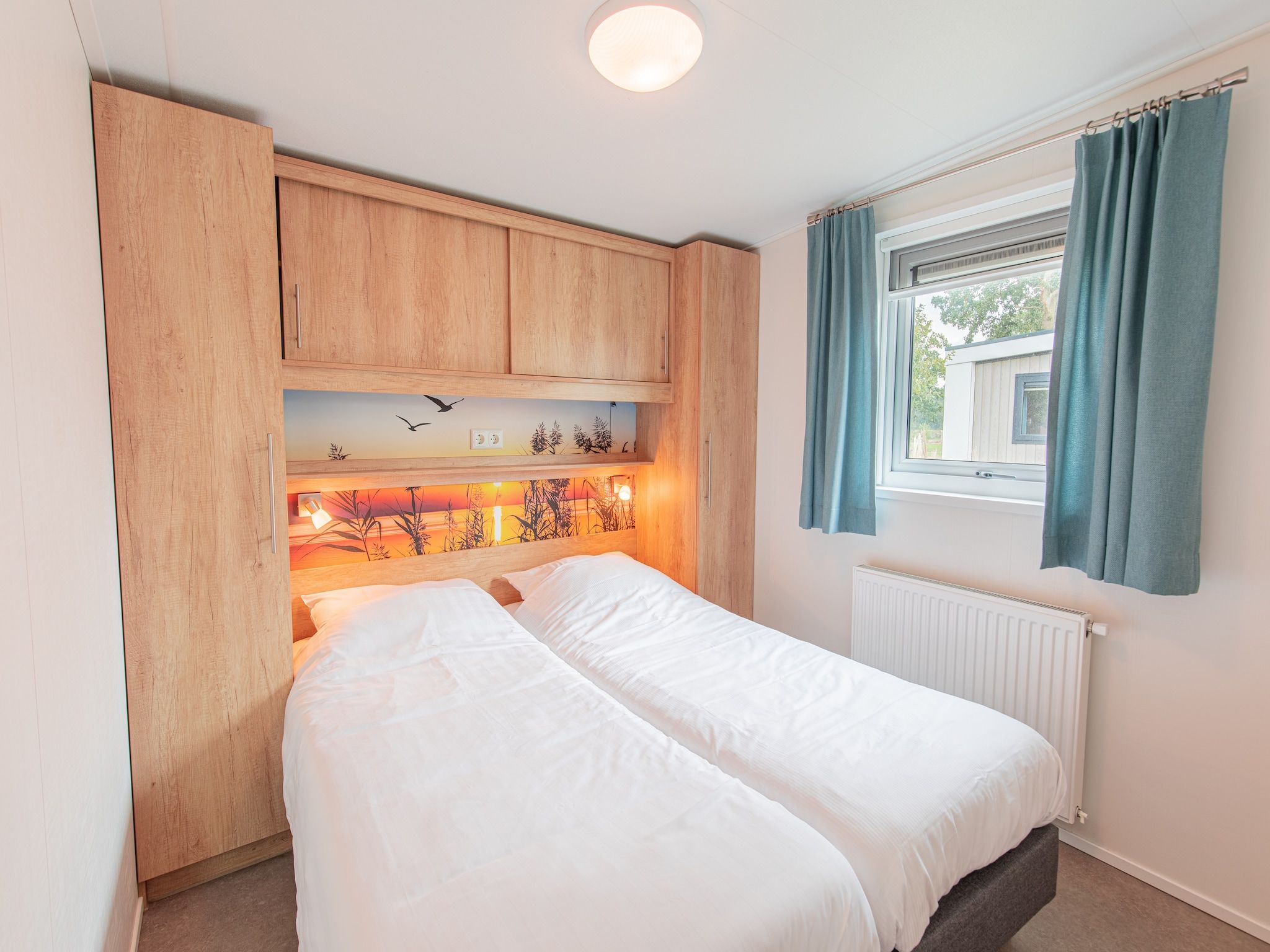 Een slaapkamer van Vakantiepark Leukermeer 9 in Well