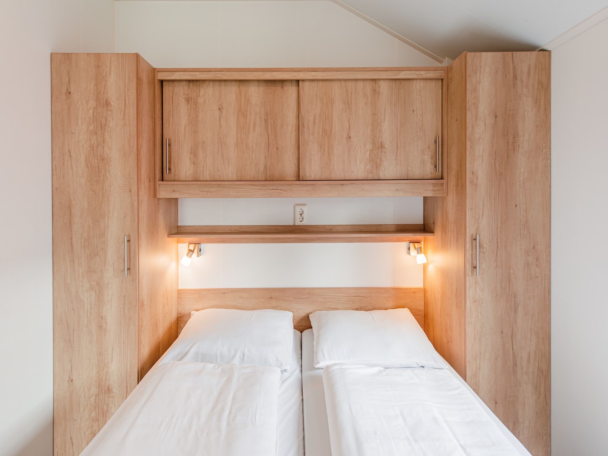 Een slaapkamer van Vakantiepark Leukermeer 11 in Well