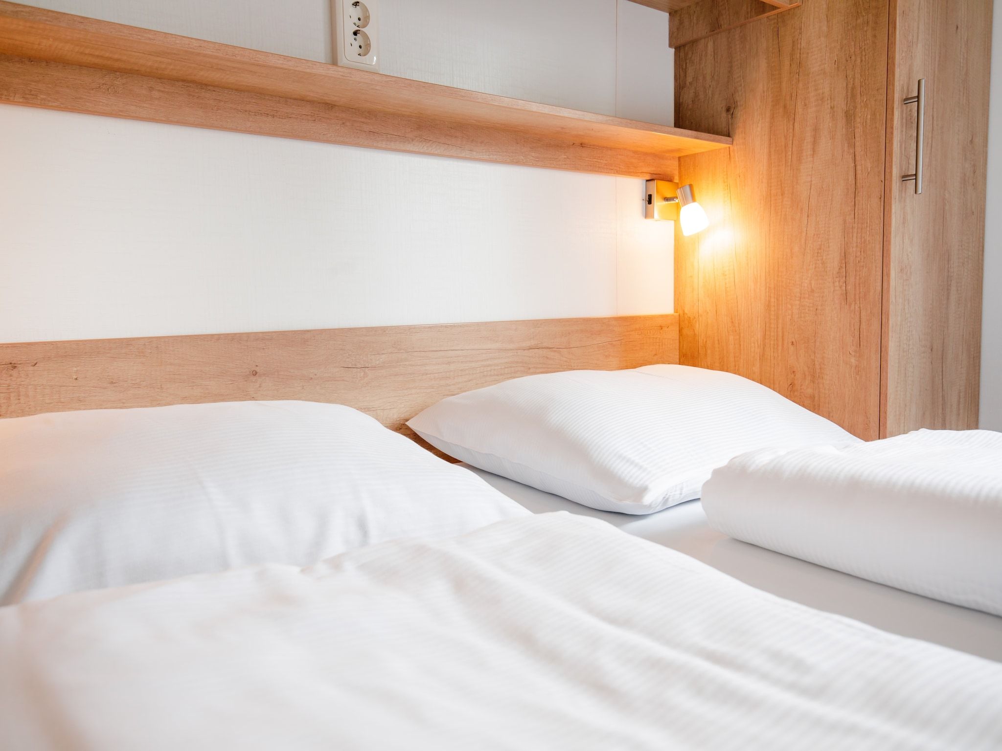 Een slaapkamer van Vakantiepark Leukermeer 11 in Well