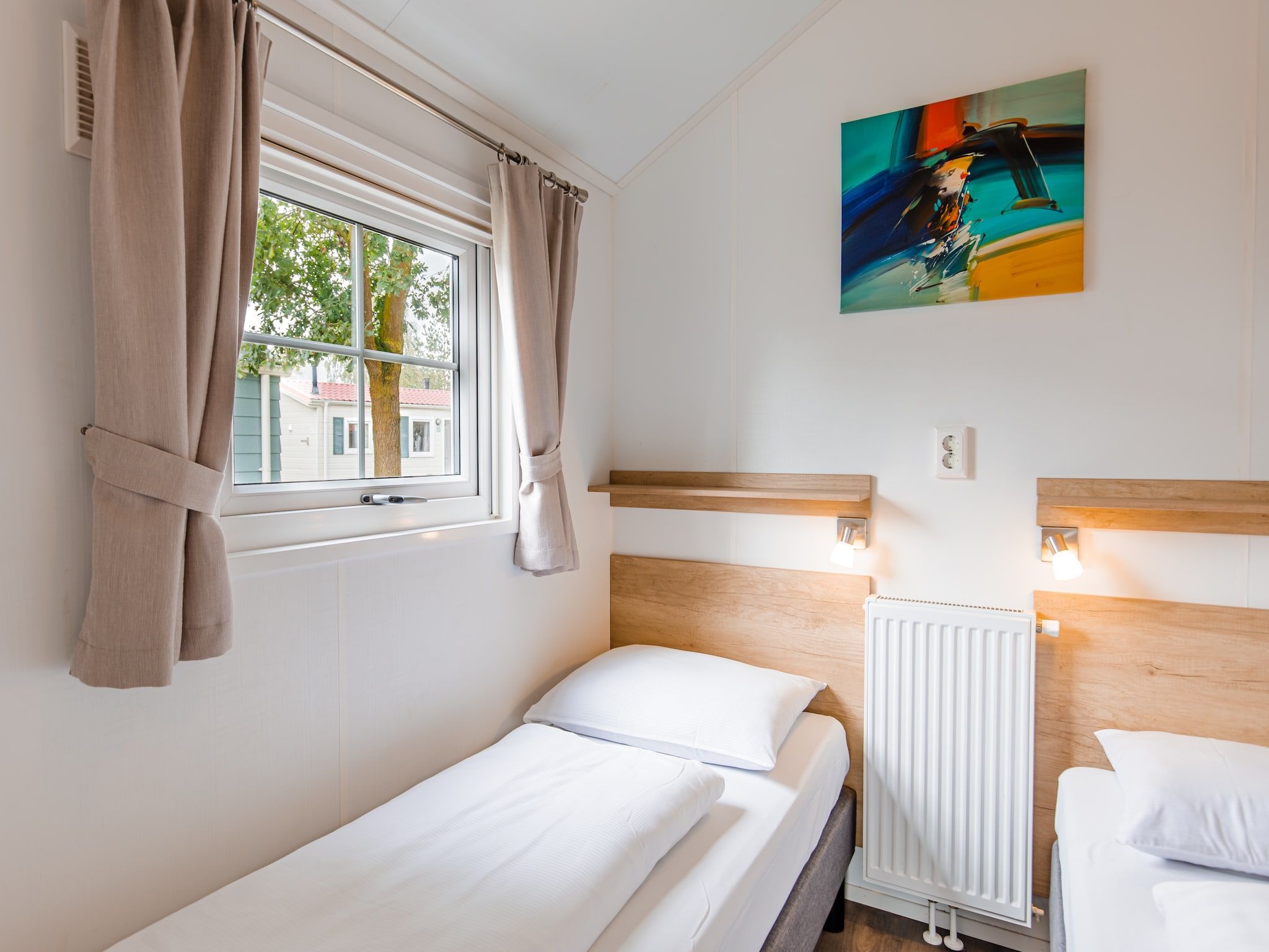 Een slaapkamer van Vakantiepark Leukermeer 11 in Well