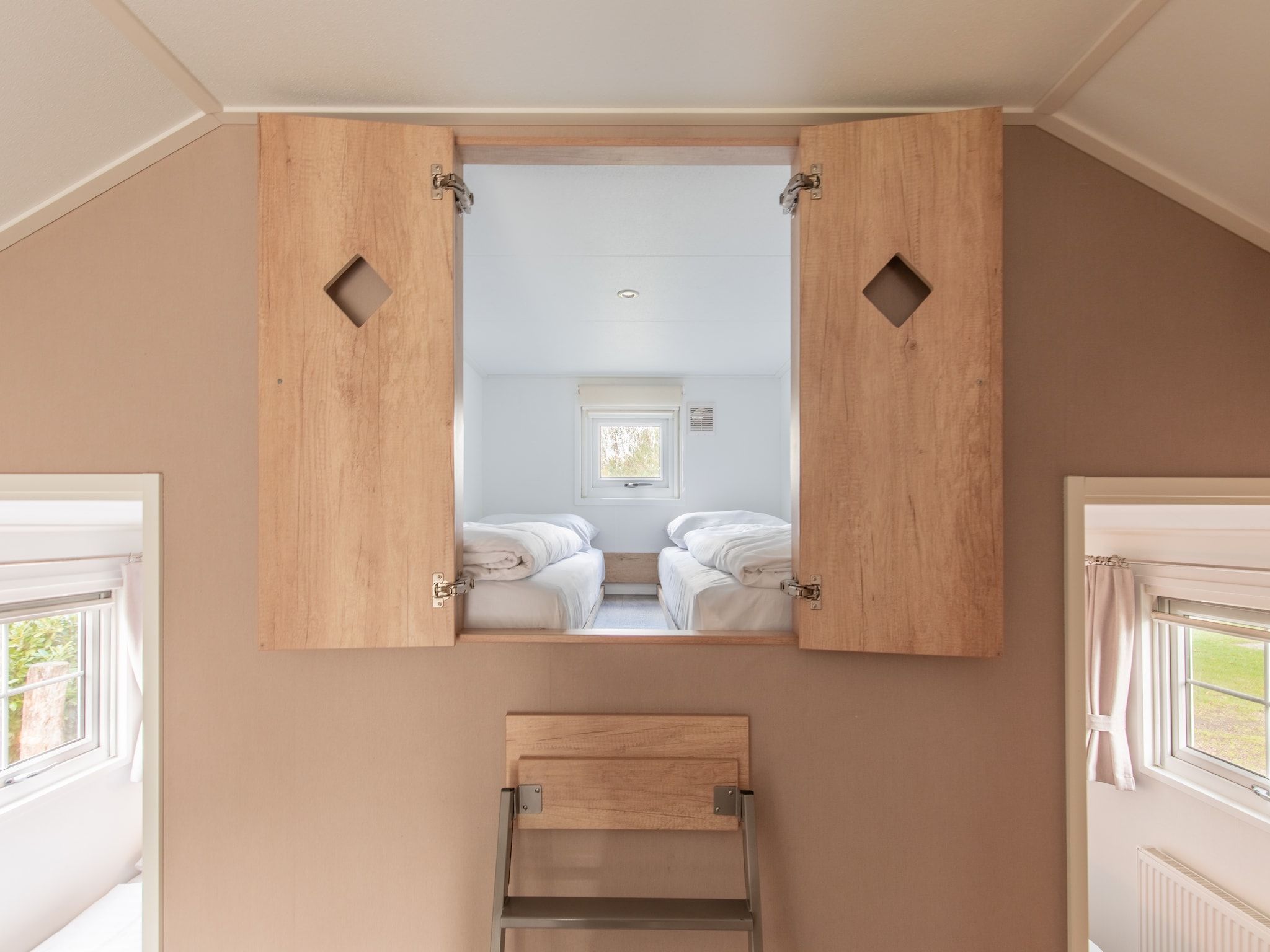 Een slaapkamer van Vakantiepark Leukermeer 12 in Well