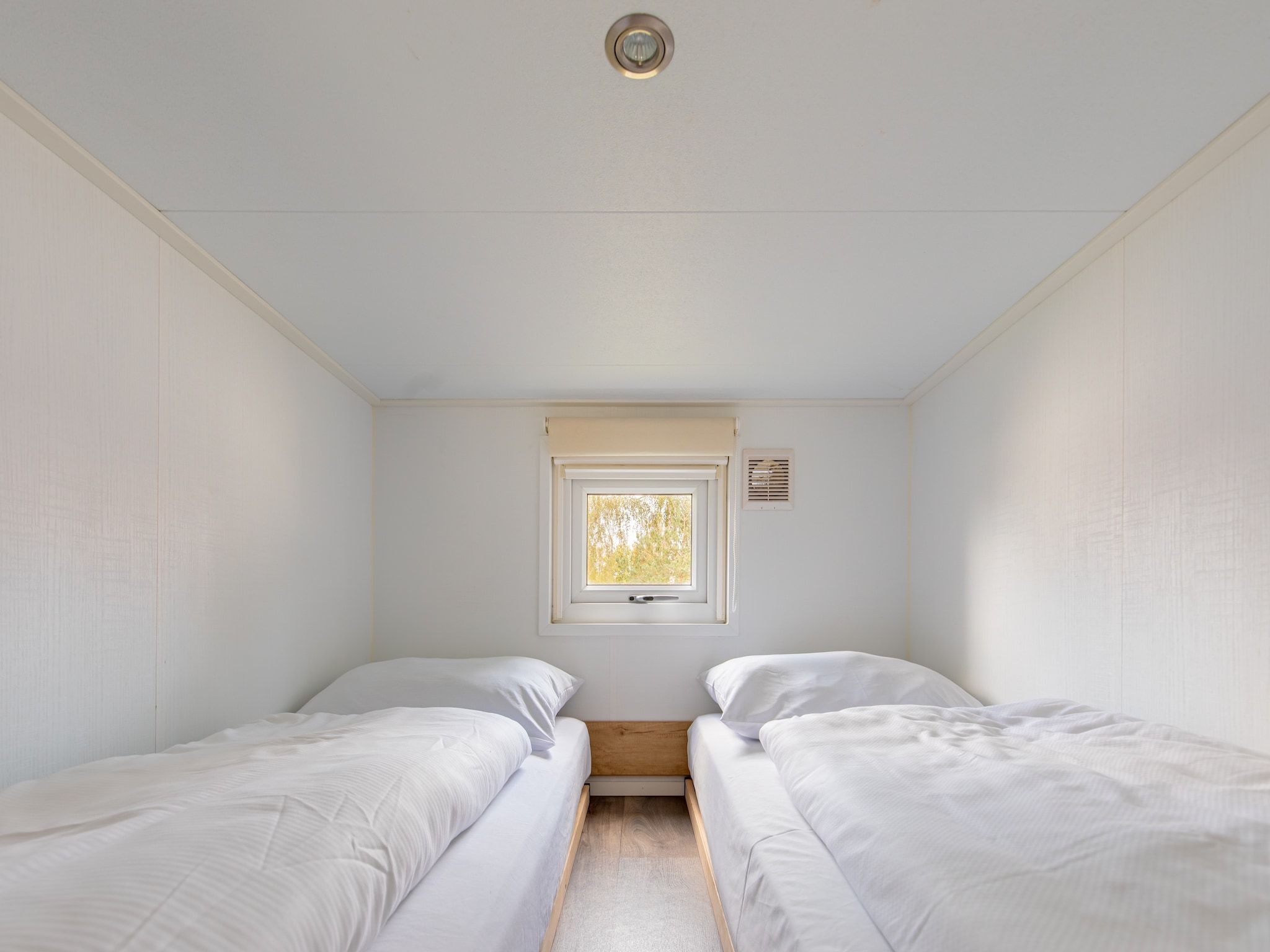 Een slaapkamer van Vakantiepark Leukermeer 12 in Well