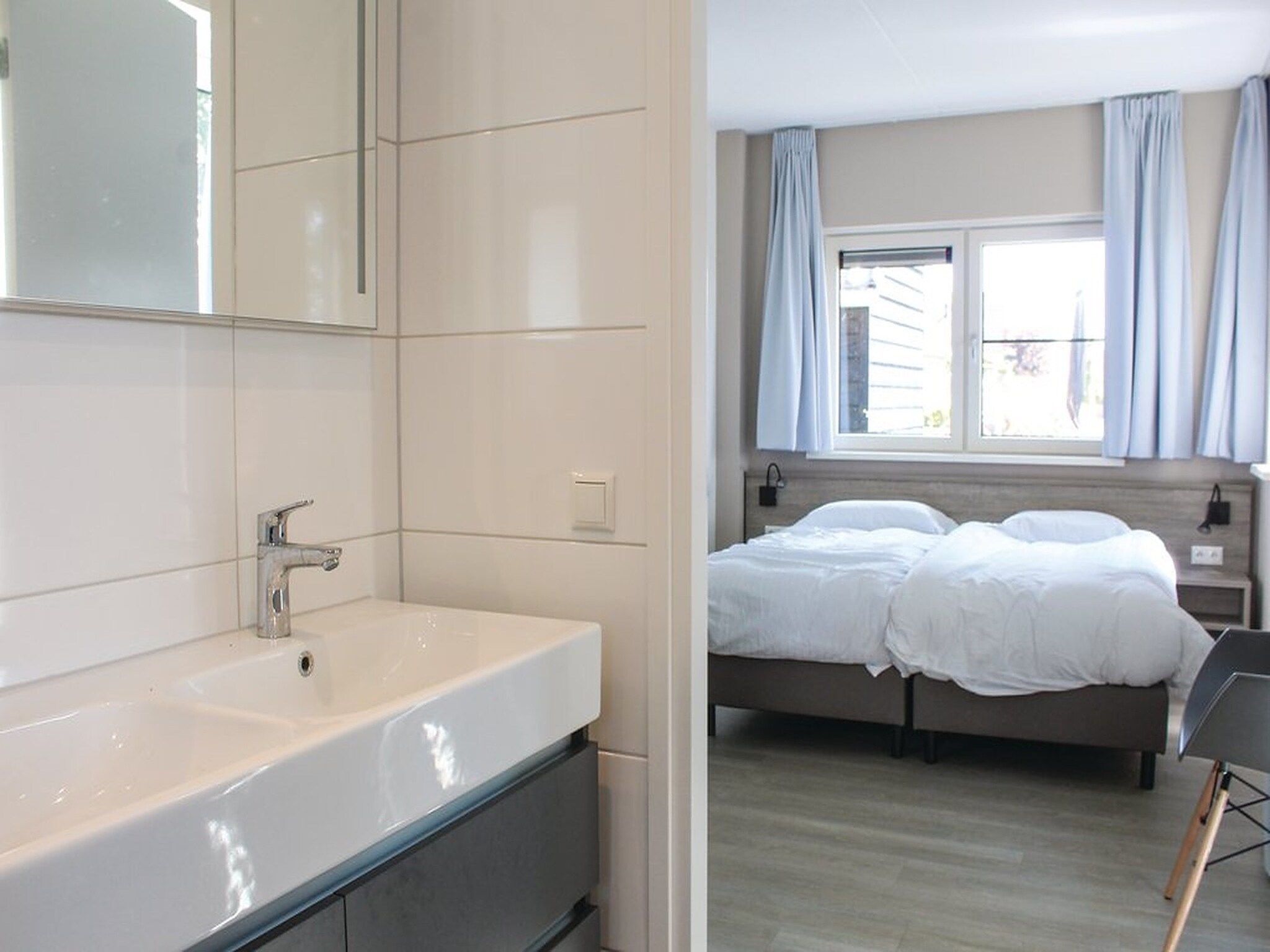 Een slaapkamer van Recreatiepark Idskenhuizen 7 in Idskenhuizen