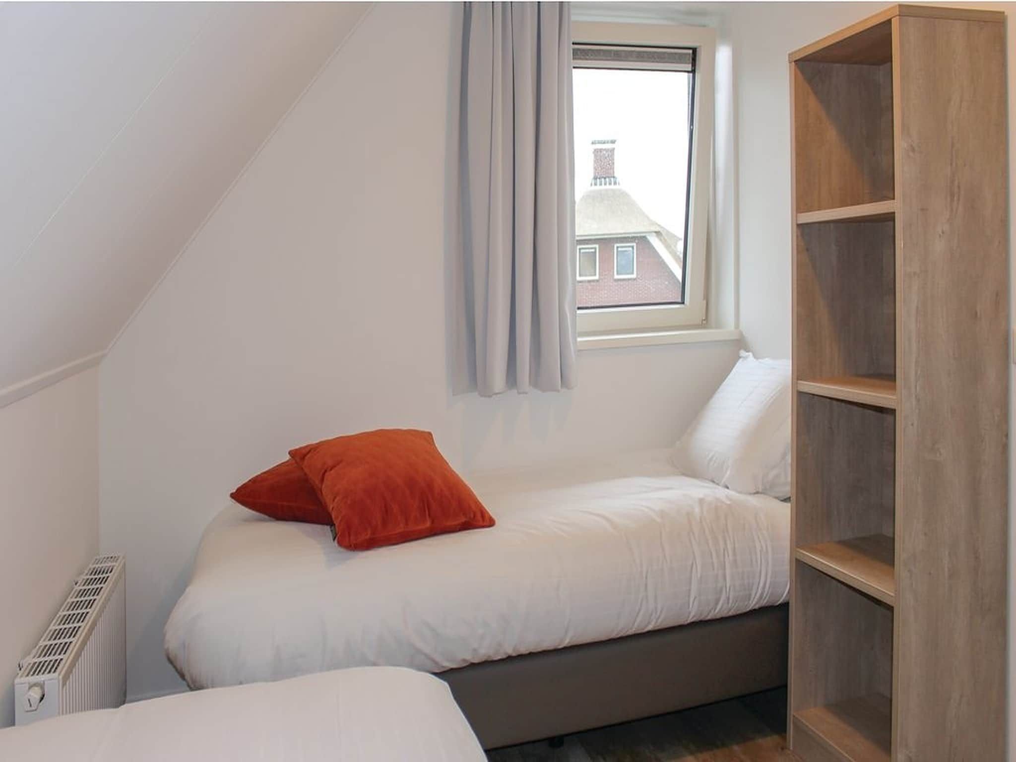 Een slaapkamer van Recreatiepark Idskenhuizen 10 in Idskenhuizen