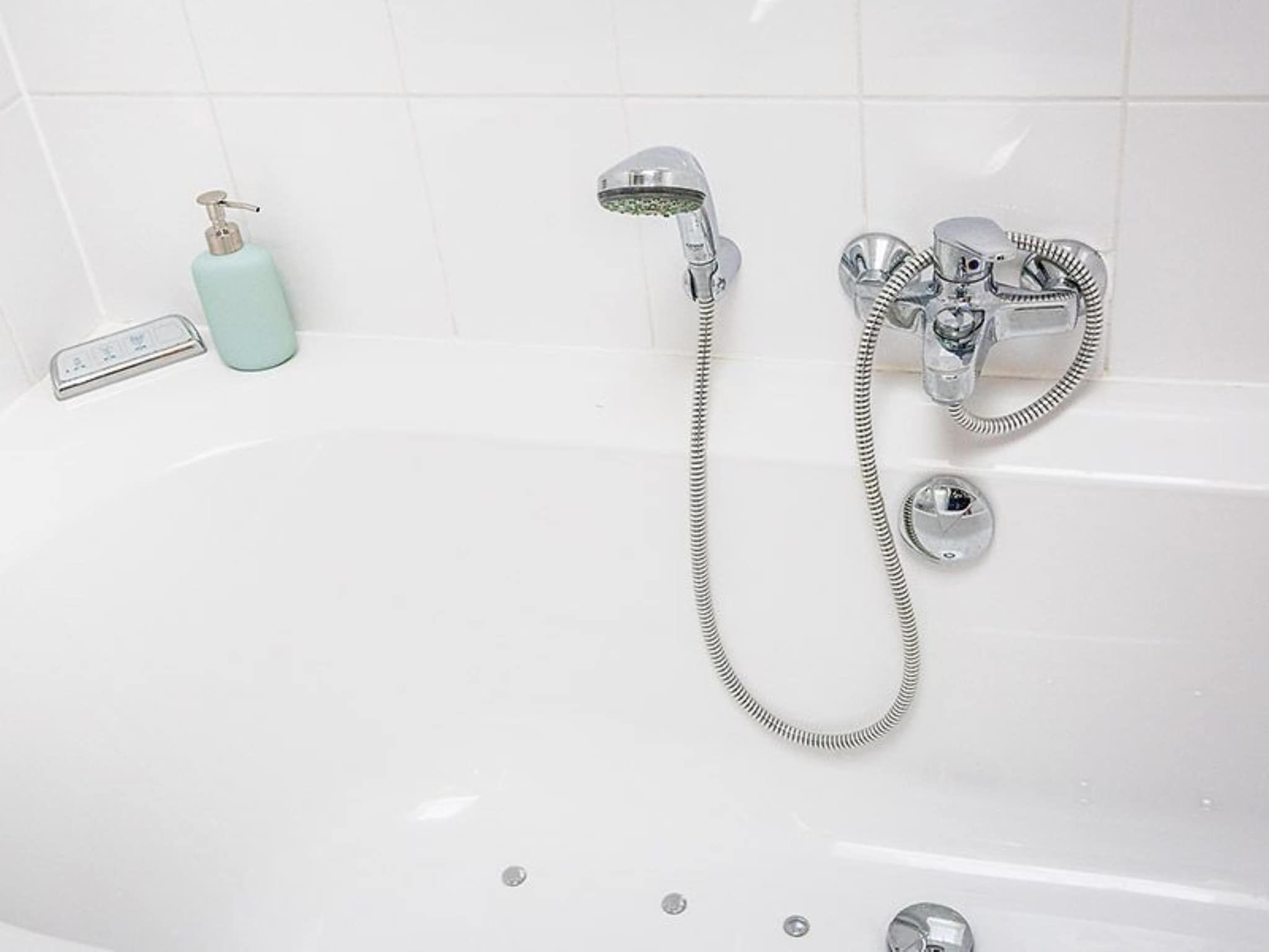 De badkamer van Golfvilla 40 Comfort in Hollum