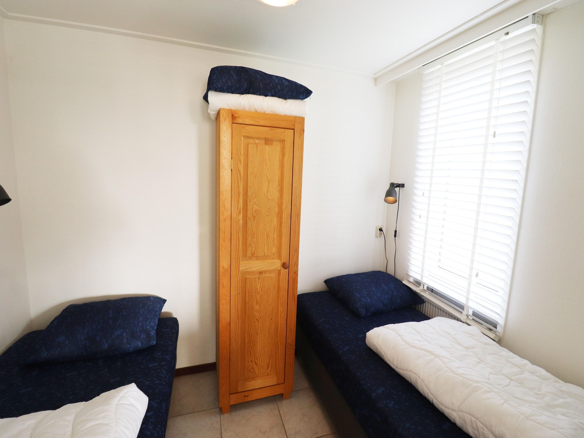 Een slaapkamer van Golfvilla 40 Comfort in Hollum