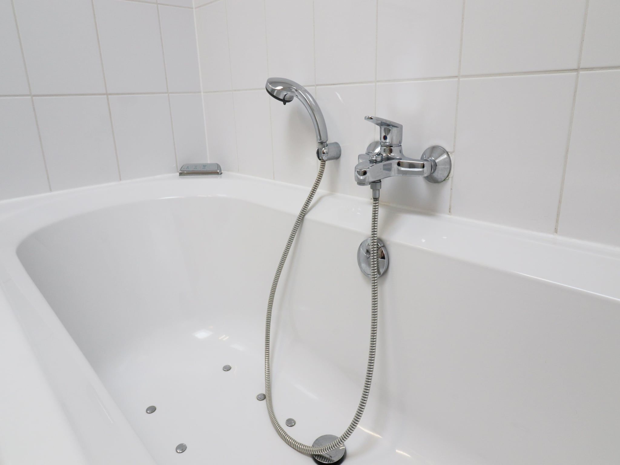 De badkamer van Golfvilla 40 Comfort in Hollum