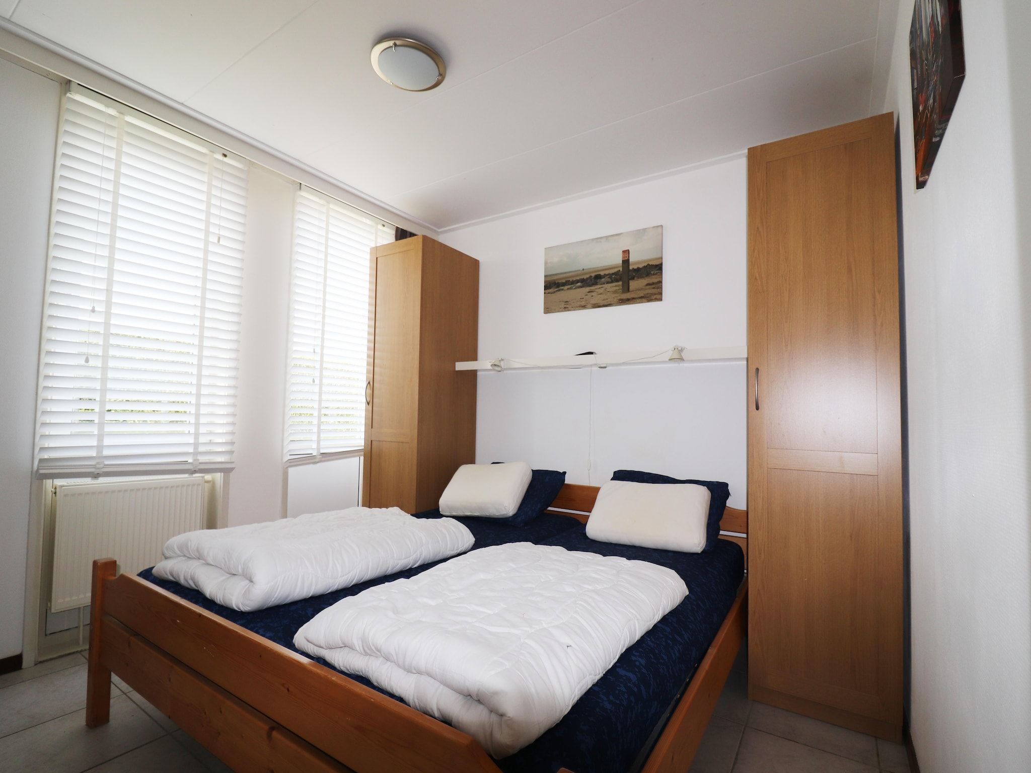 Een slaapkamer van Golfvilla 40 Comfort in Hollum