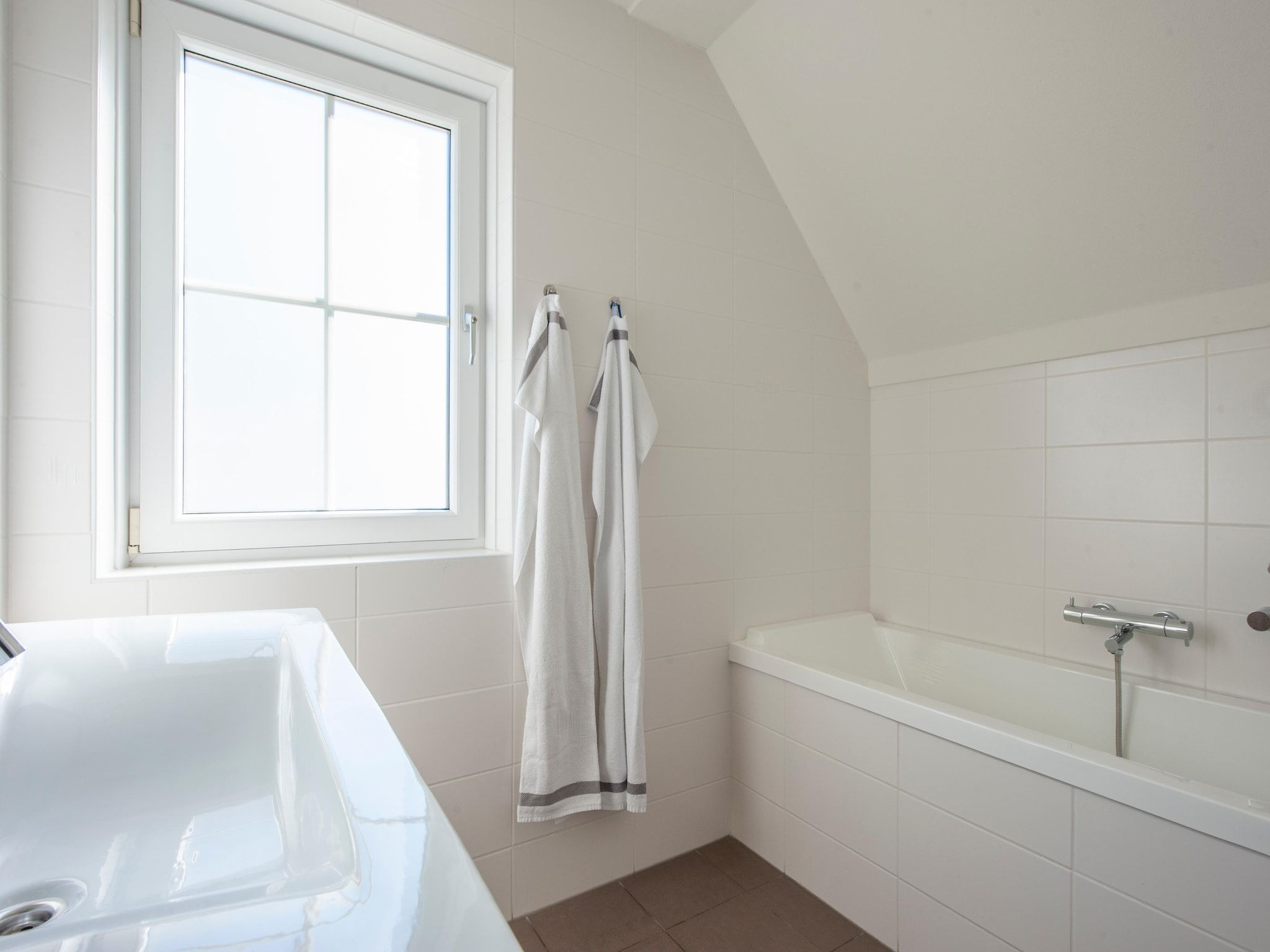 De badkamer van Noordzee Résidence Cadzand-Bad 27 in Cadzand-Bad