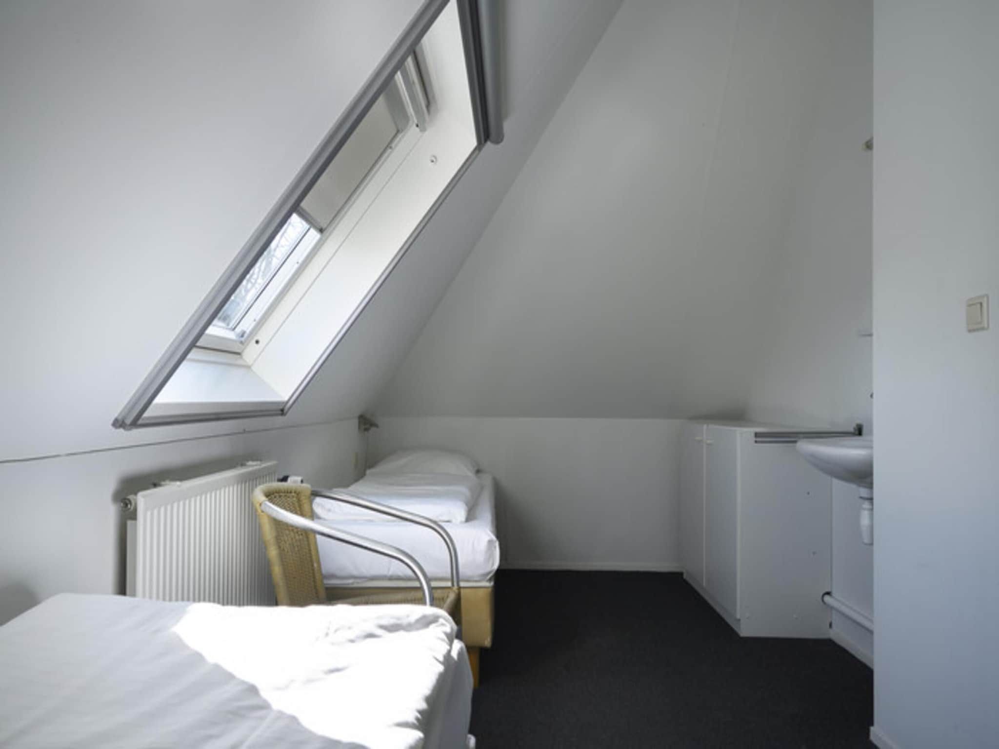 Een slaapkamer van Skip Wellness de luxe met sauna in Friesland