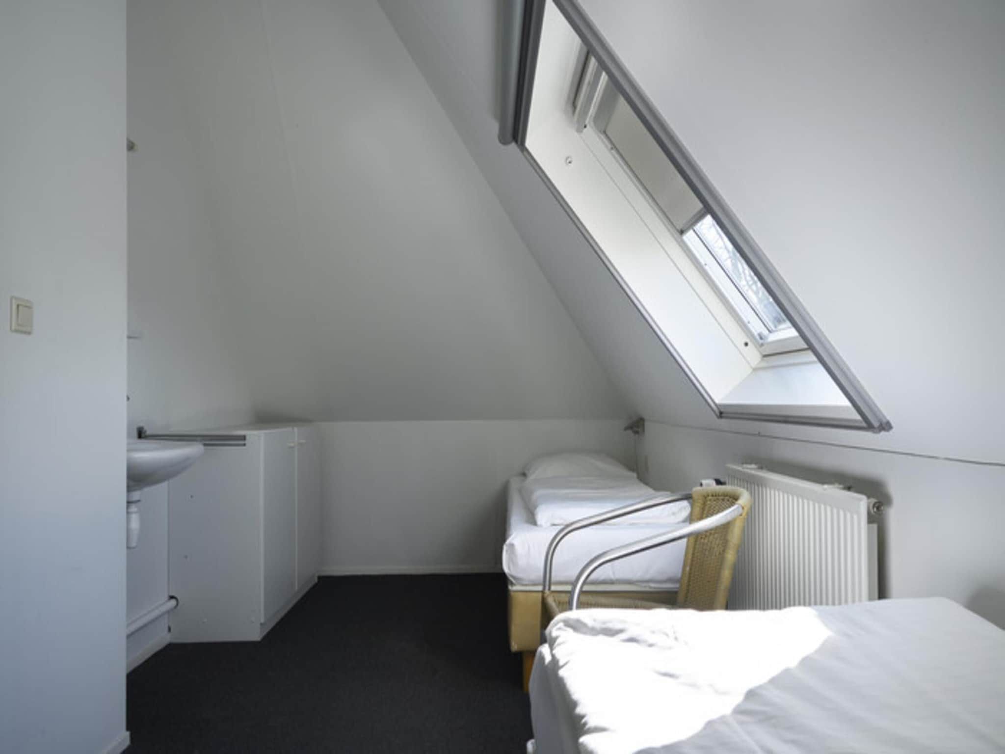 Een slaapkamer van Skip Wellness de luxe met sauna in Friesland