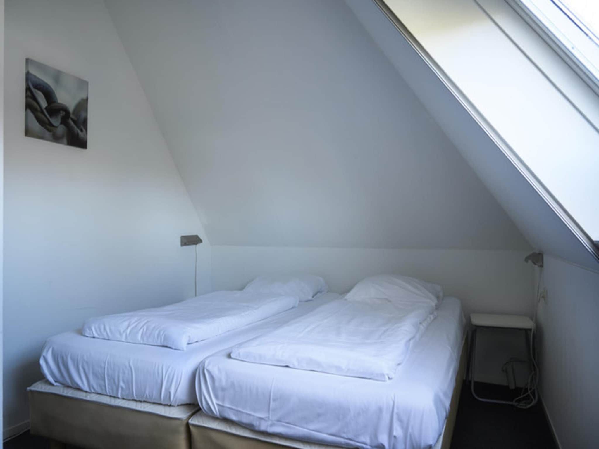 Een slaapkamer van Skip Wellness de luxe met sauna in Friesland