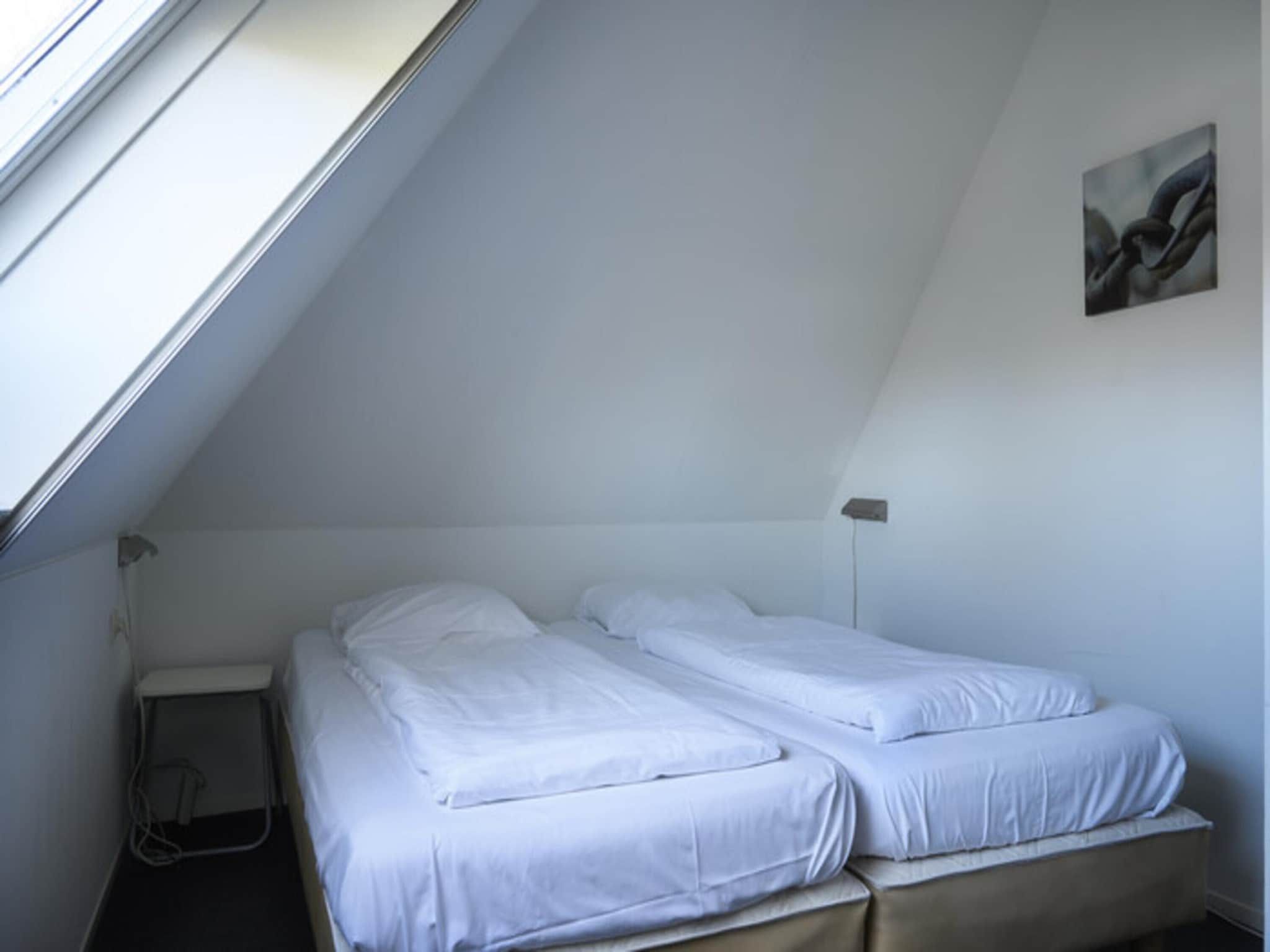 Een slaapkamer van Skip Wellness de luxe met sauna in Friesland