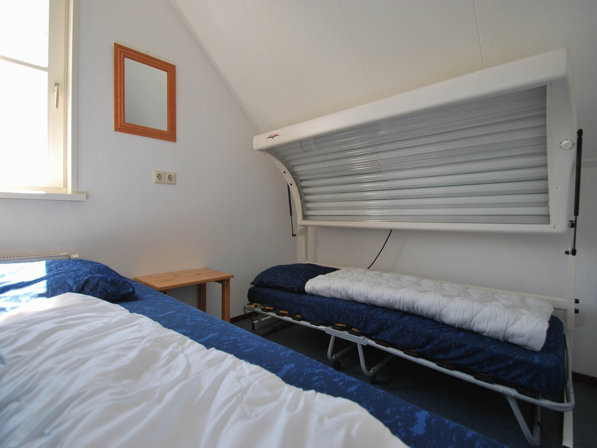 Een slaapkamer van Duinvilla - 4 personen in Makkum