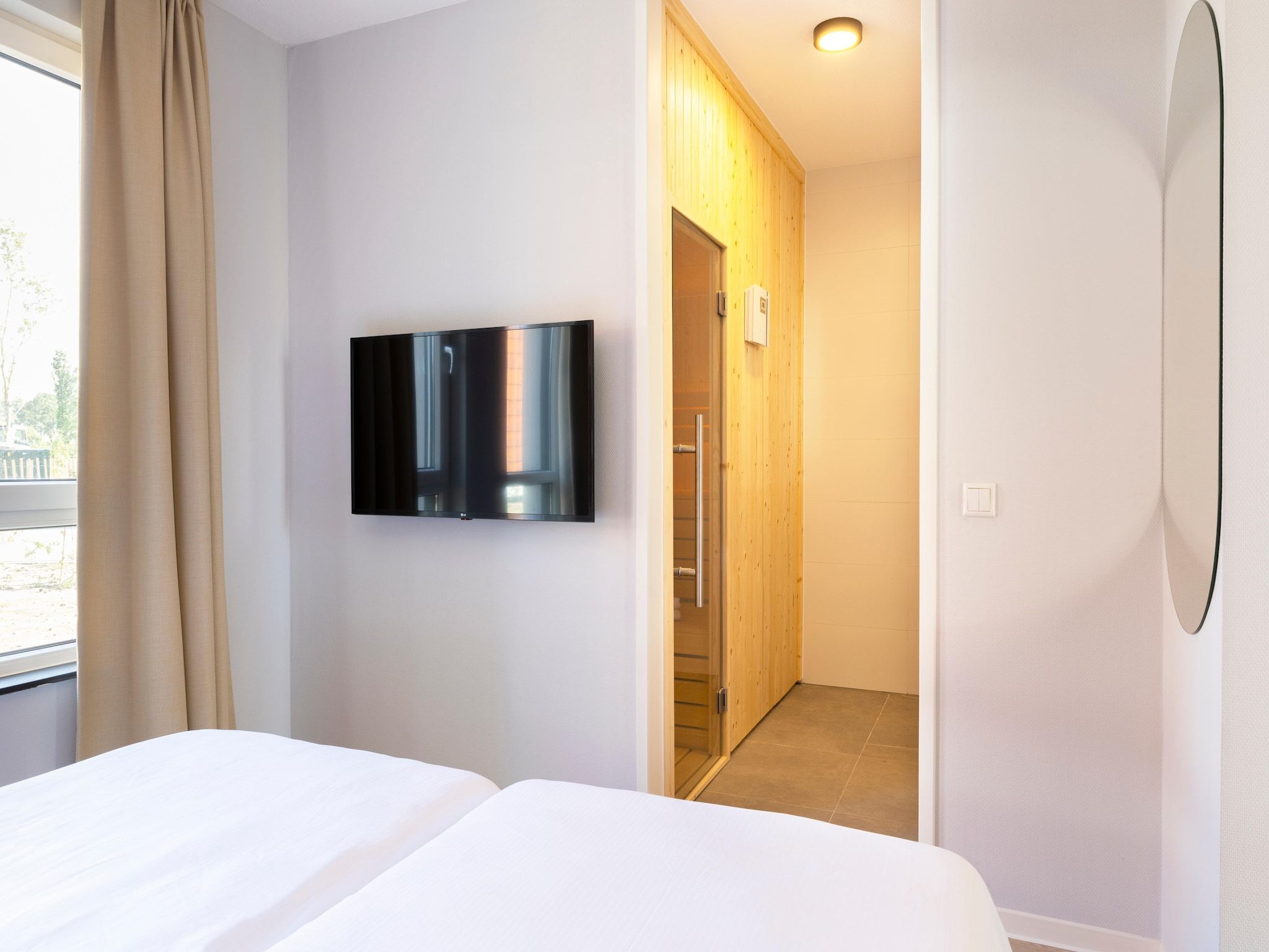 Een slaapkamer van Resort Nieuwvliet-Bad 19 in Nieuwvliet