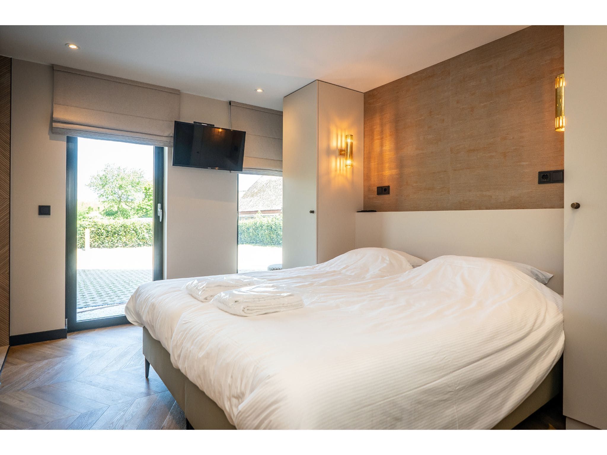 Een slaapkamer van Type N Luxe Villa Zeeburg in De Cocksdorp