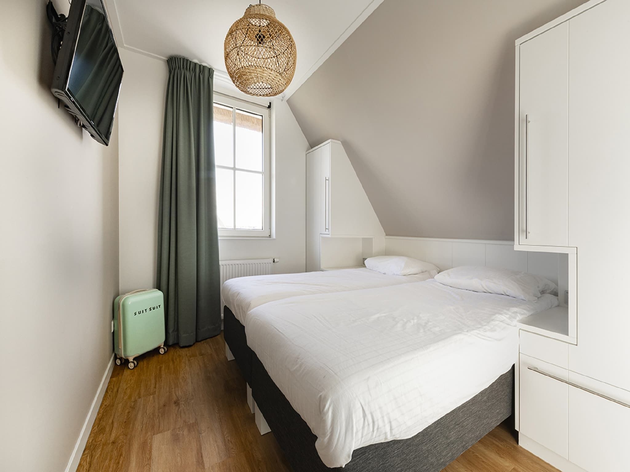 Een slaapkamer van Friese Meren Villa's 22 in Delfstrahuizen