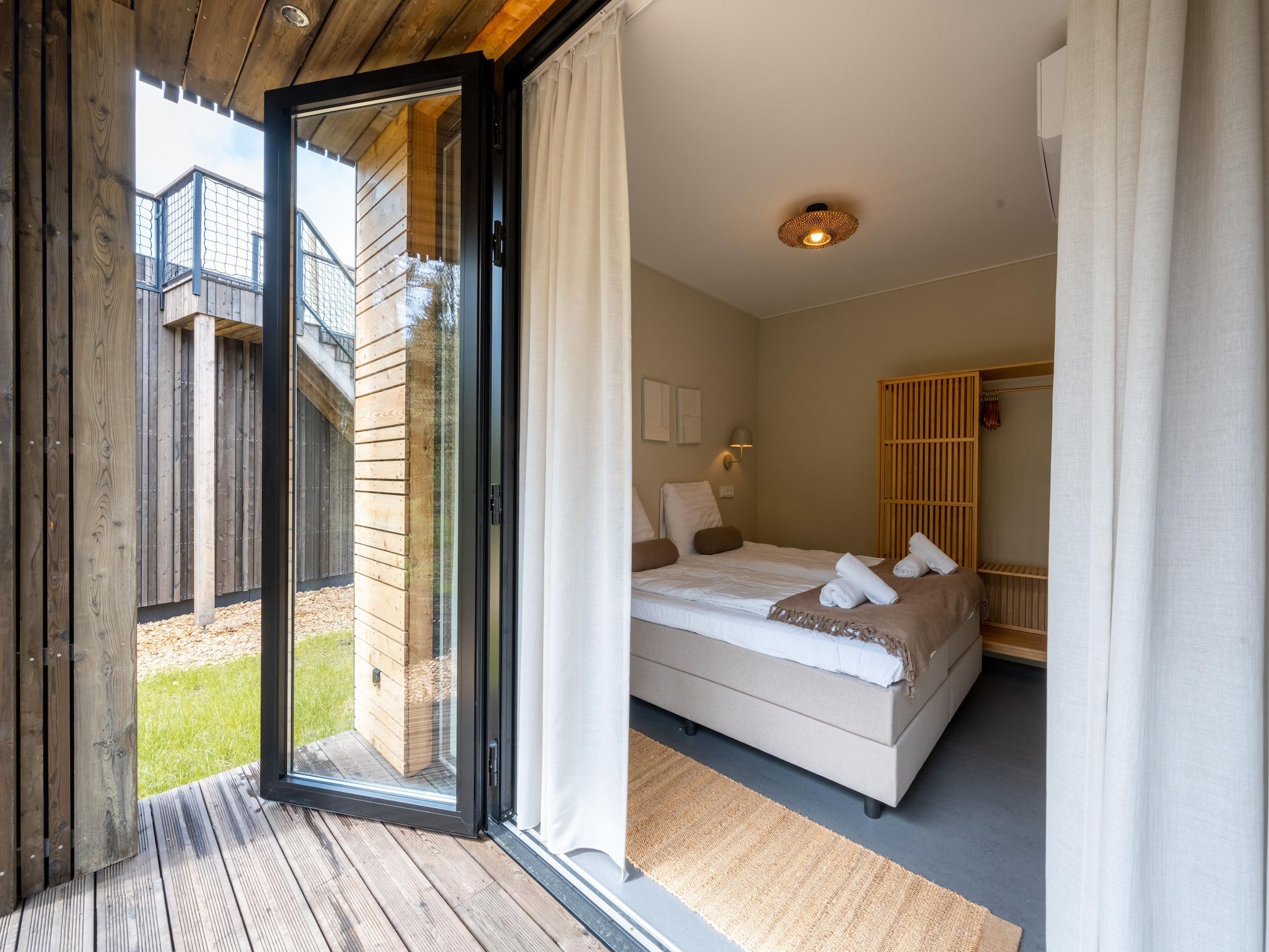 Een slaapkamer van Resort de Parel 6 in Zeewolde