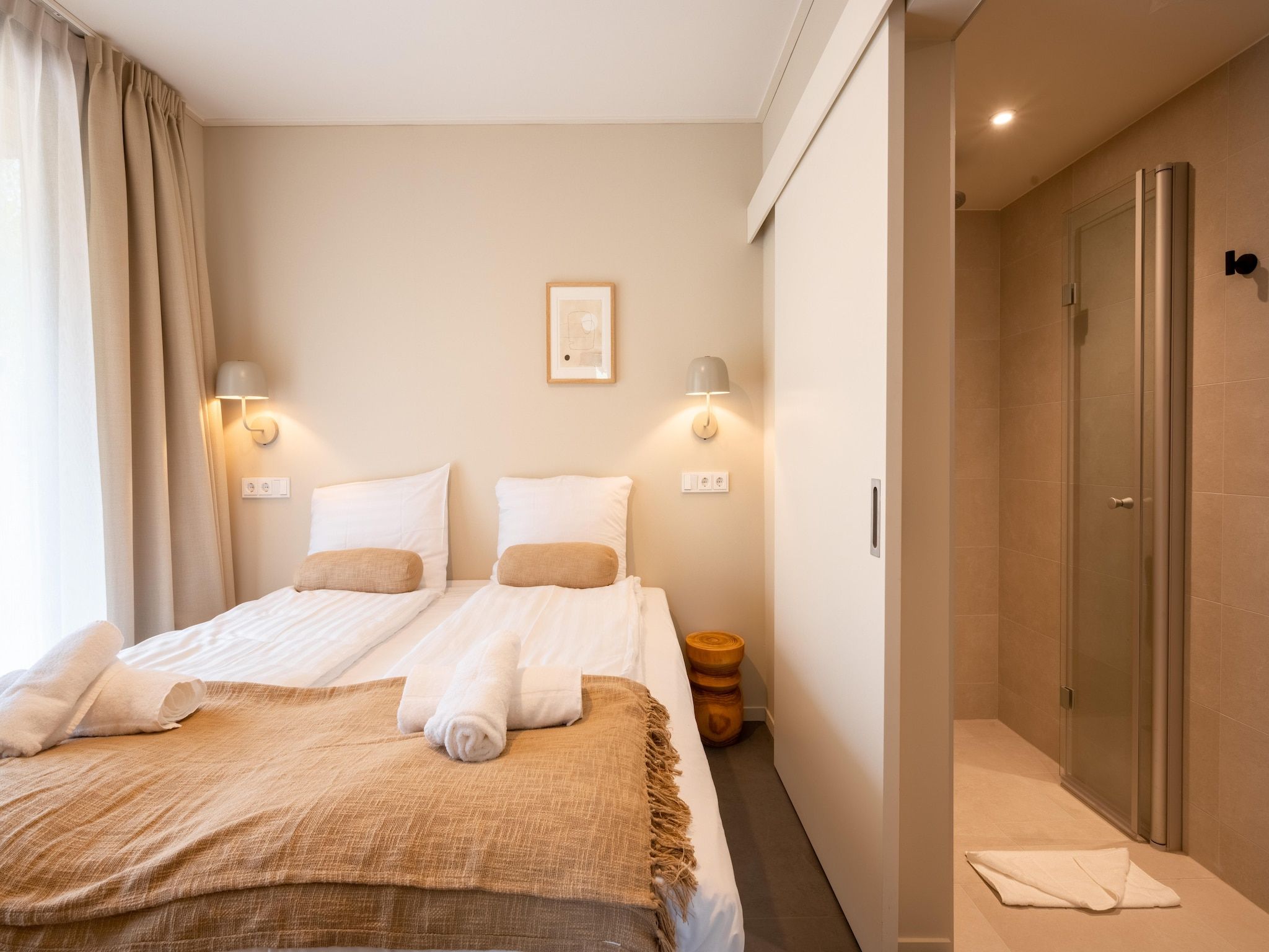 Een slaapkamer van Resort de Parel 9 in Zeewolde