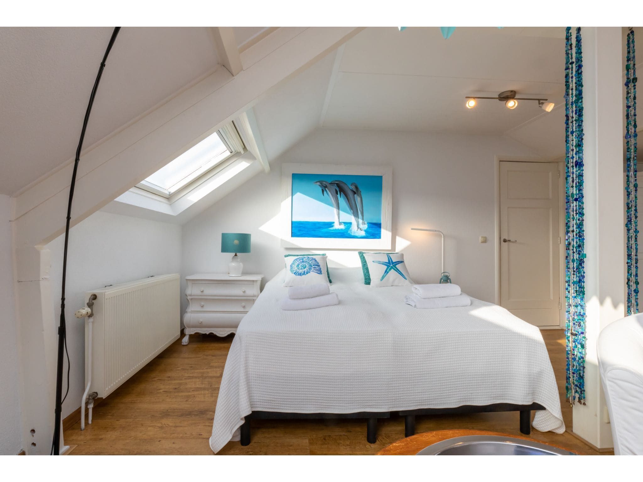 Een slaapkamer van Bovenappartement - Zuidstraat 111a in Westkapelle