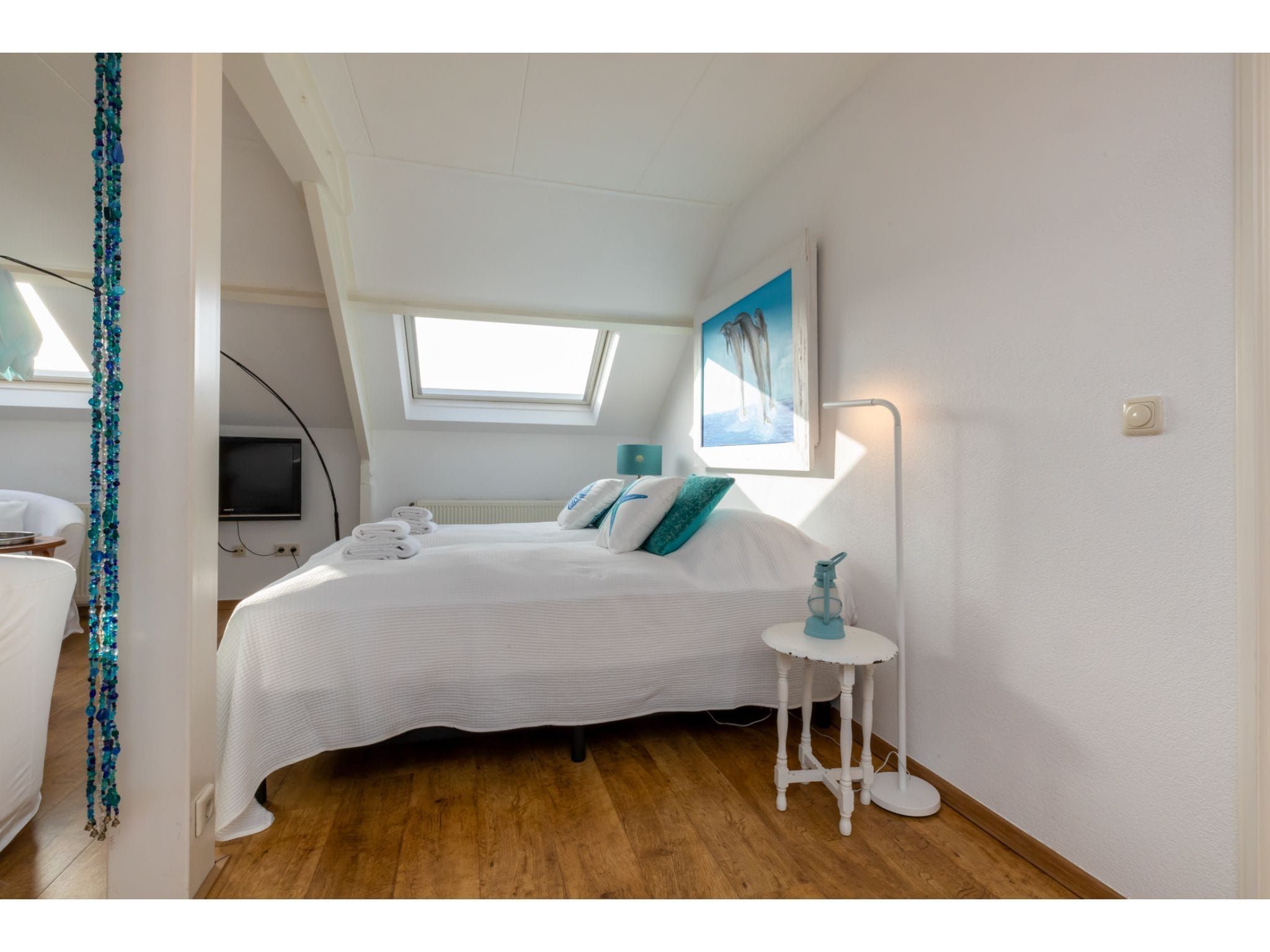 Een slaapkamer van Bovenappartement - Zuidstraat 111a in Westkapelle