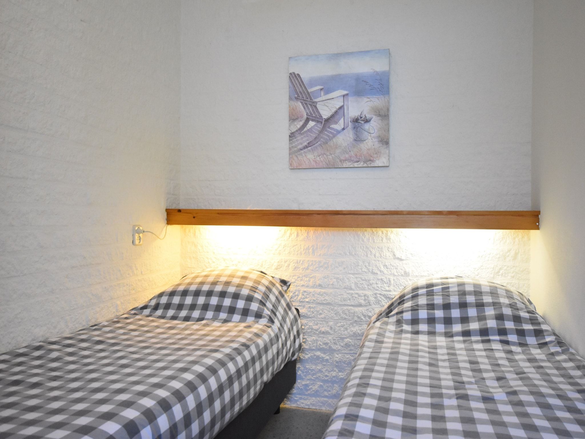 Een slaapkamer van Bungalowpark Campanula 3 in St. Maartenszee