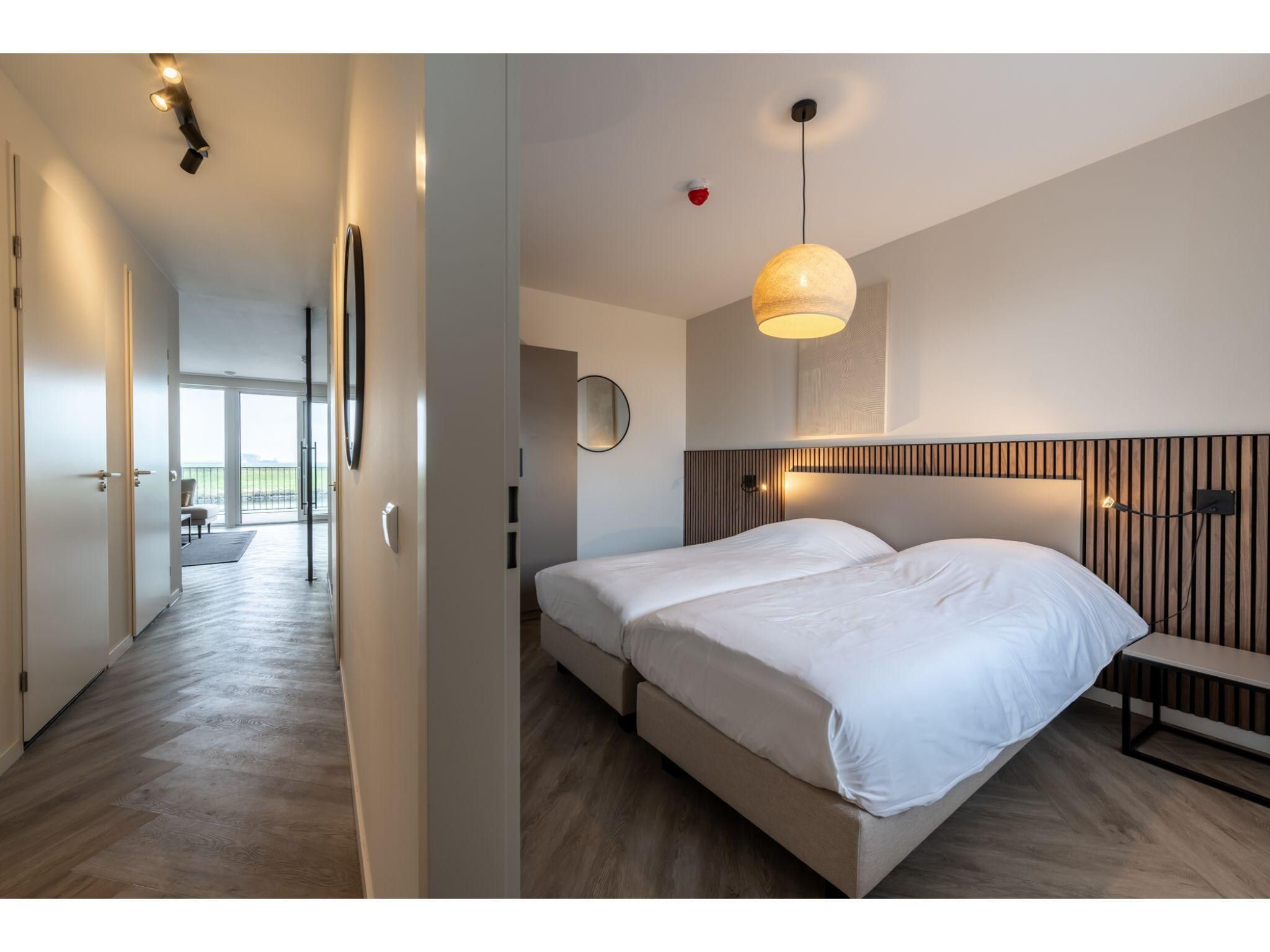 Een slaapkamer van Harbour Loft1J-havenzicht in Kamperland