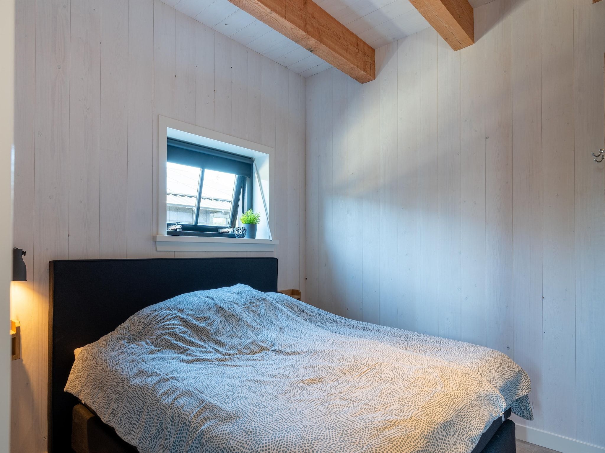 Een slaapkamer van Hazenborgh - Wagenboet in Callantsoog