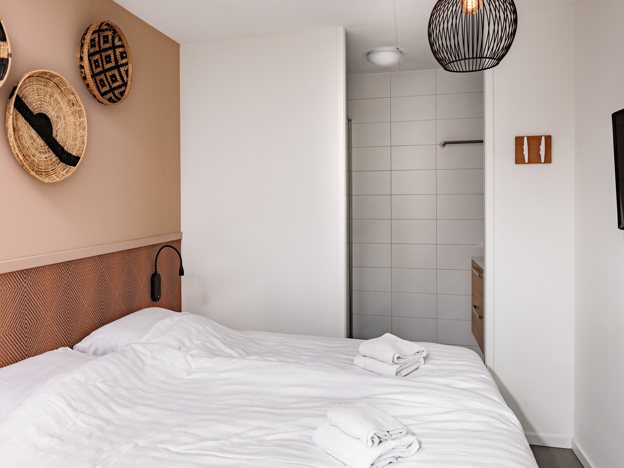 Een slaapkamer van Duinresort Dunimar 3 in Noordwijkerhout