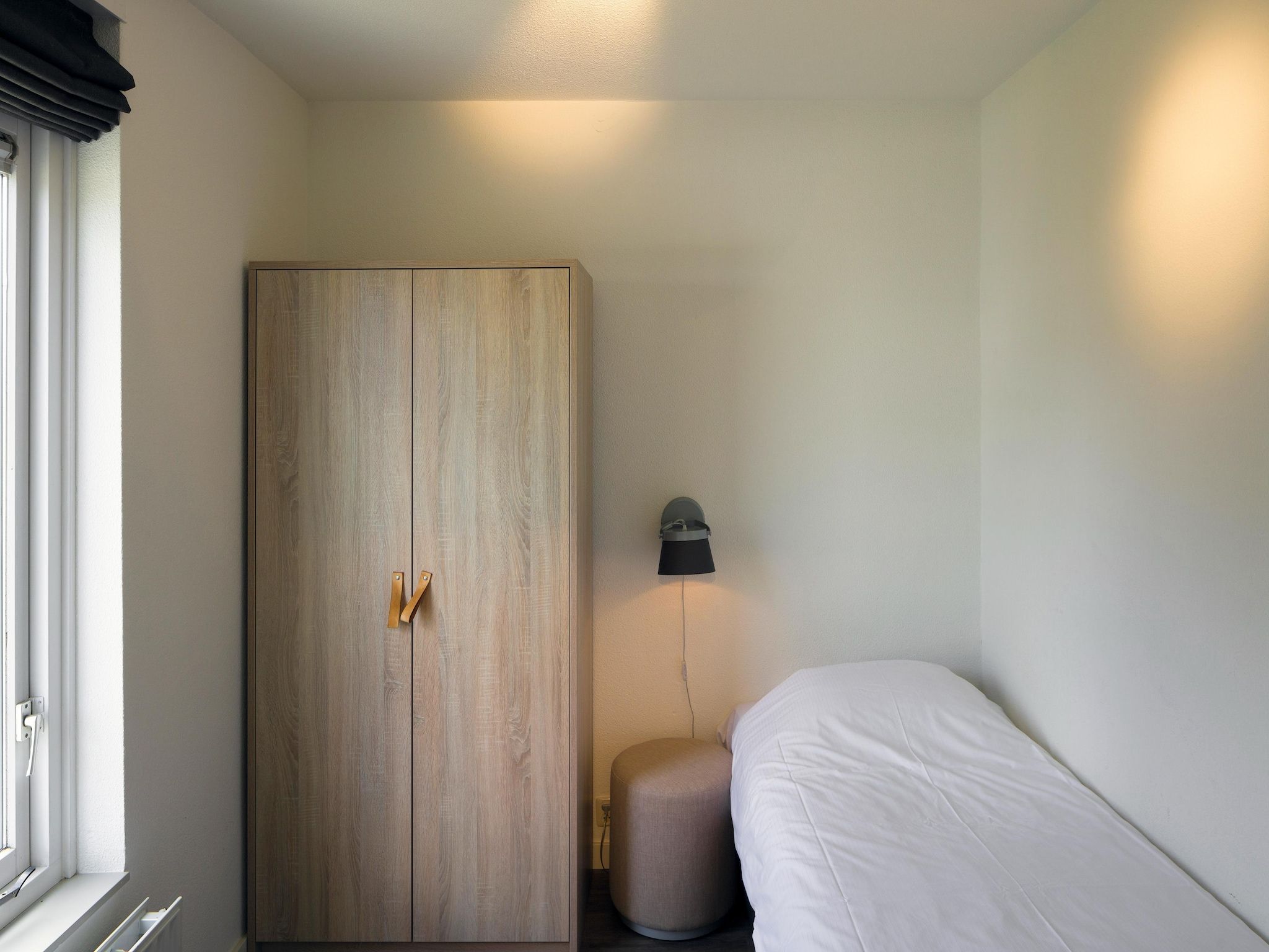 Een slaapkamer van Roompot Beach Resort 25 in Kamperland