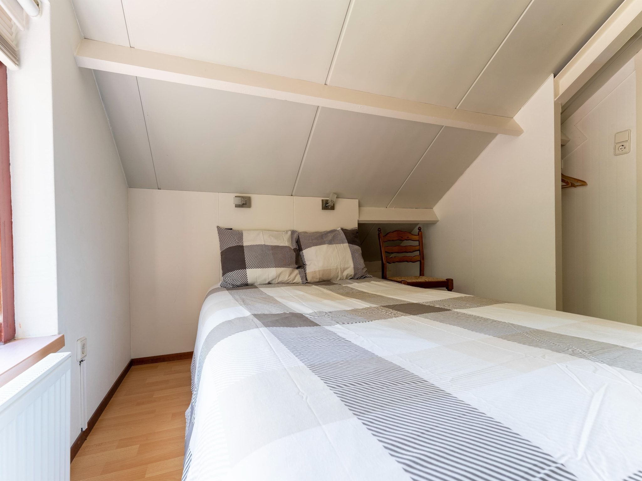 Een slaapkamer van Landingsweg 80 in Baarland