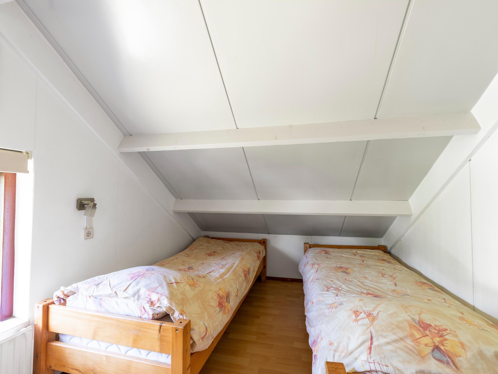 Een slaapkamer van Landingsweg 80 in Baarland