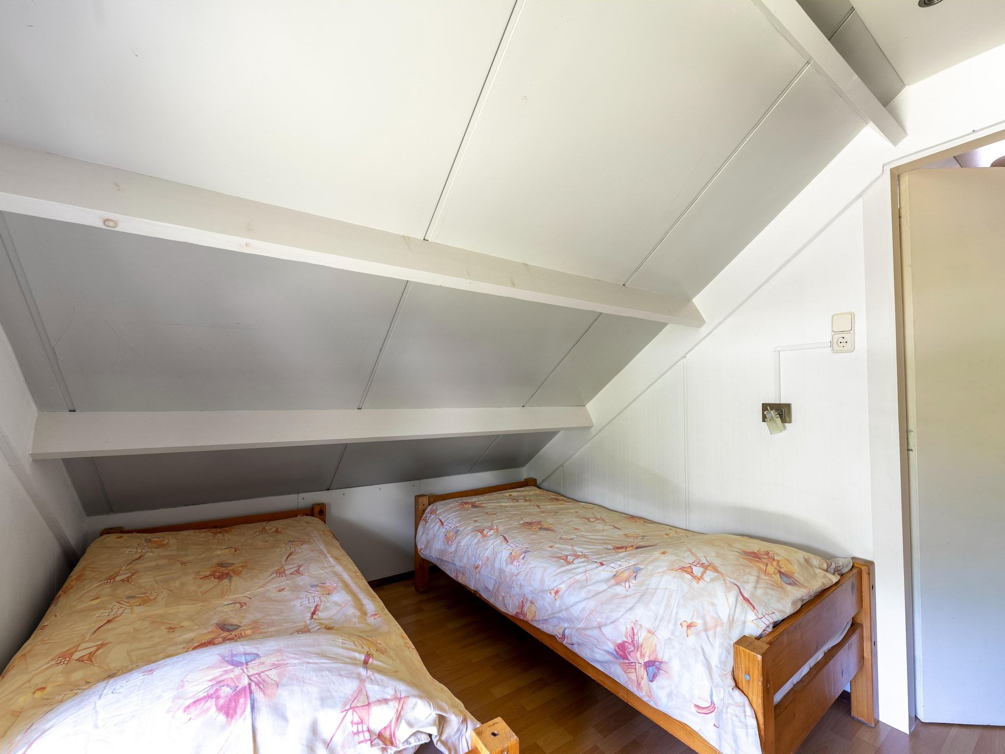 Een slaapkamer van Landingsweg 80 in Baarland