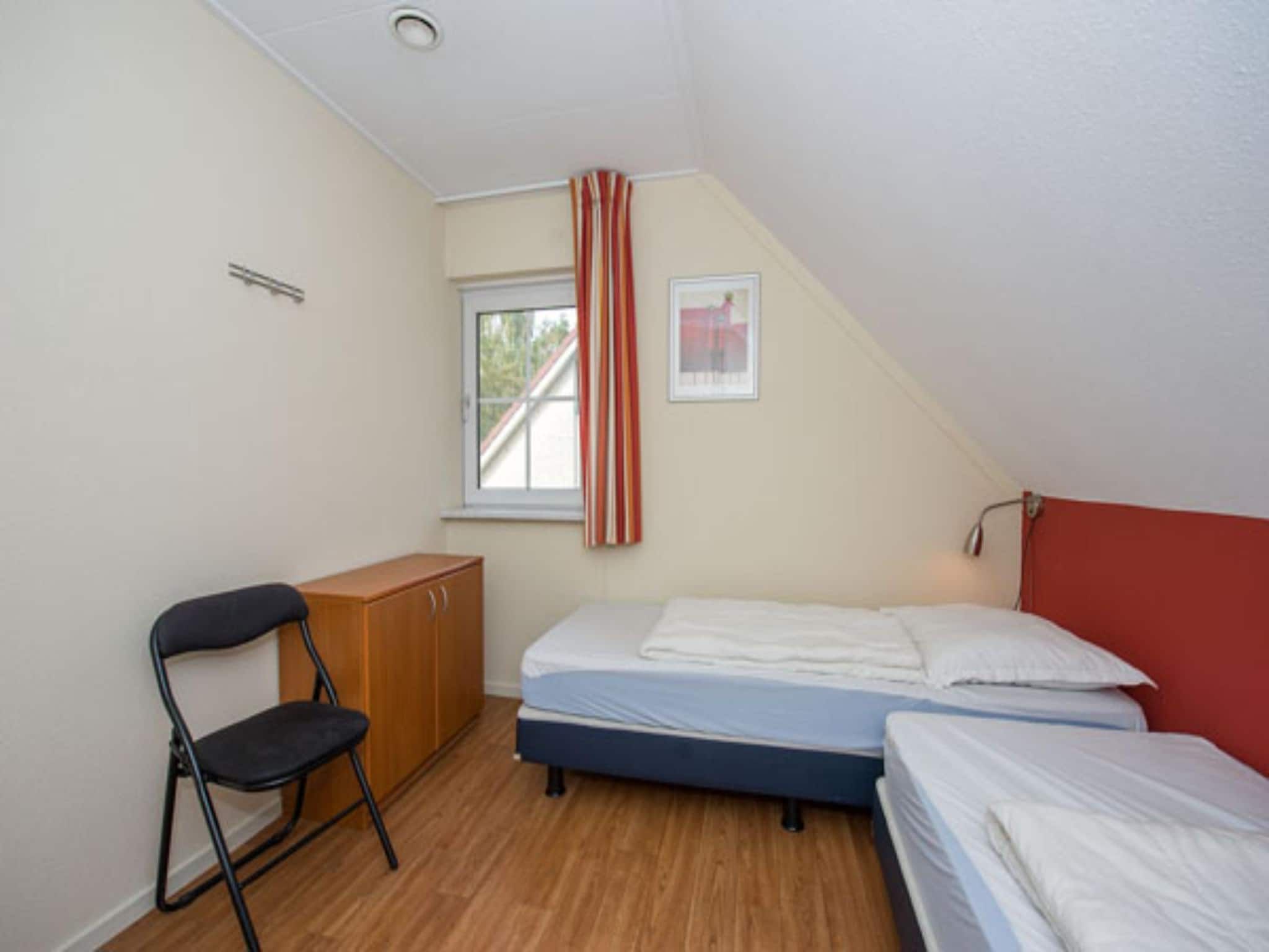 Een slaapkamer van Vakantiepark Hellendoorn 3 in Hellendoorn