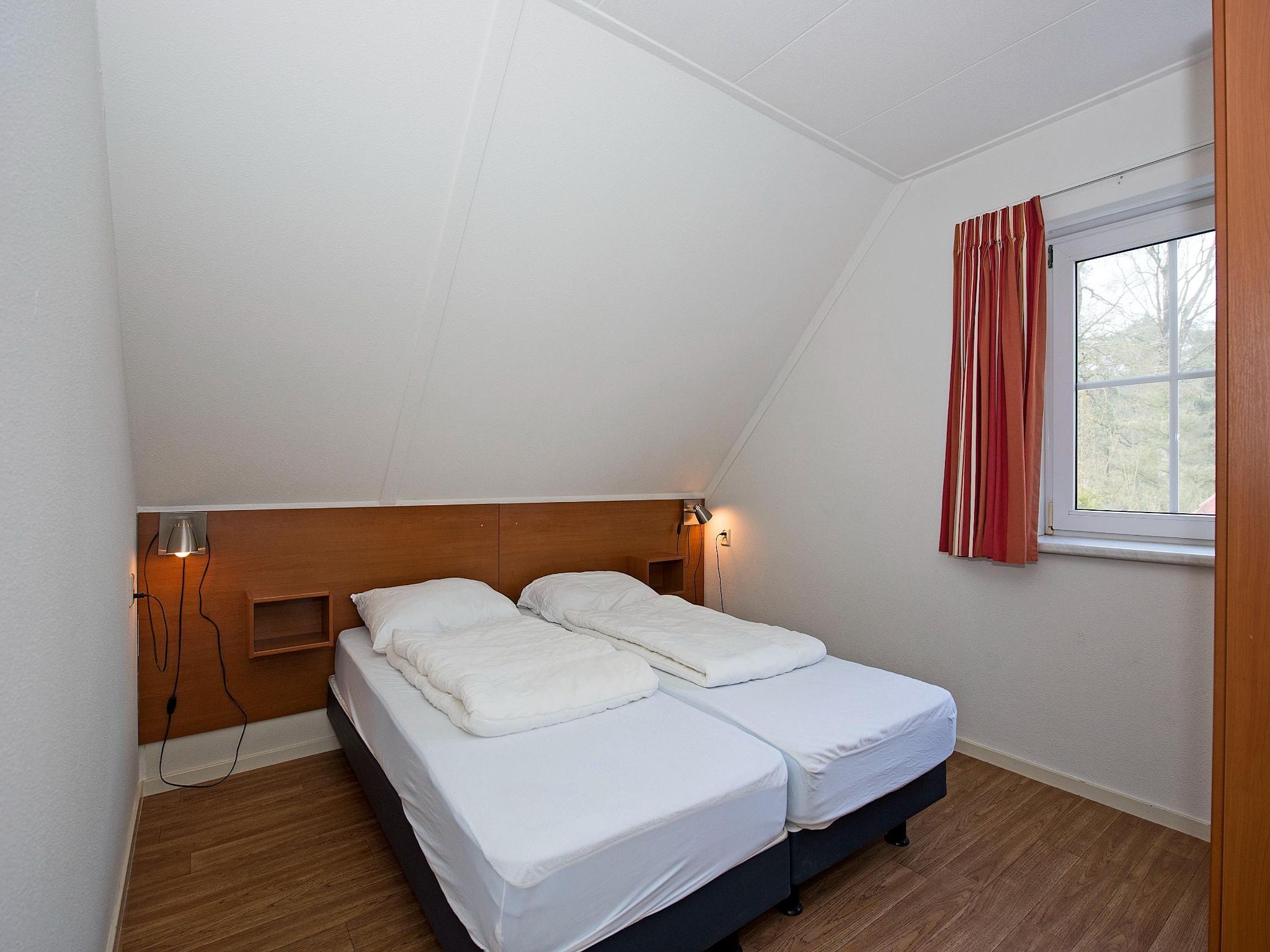 Een slaapkamer van Vakantiepark Hellendoorn 4 in Hellendoorn