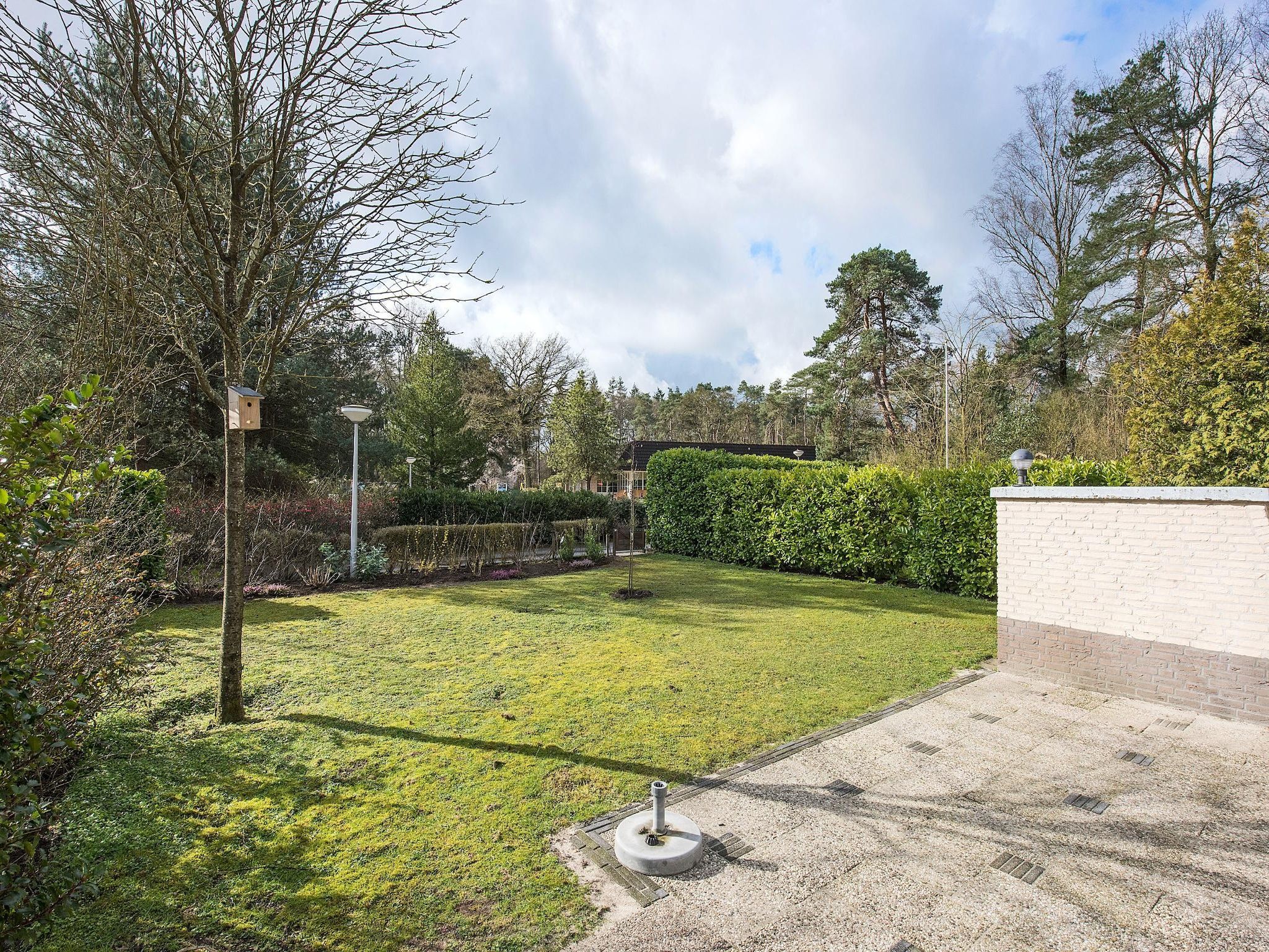 De tuin van Vakantiepark Hellendoorn 4 in Hellendoorn