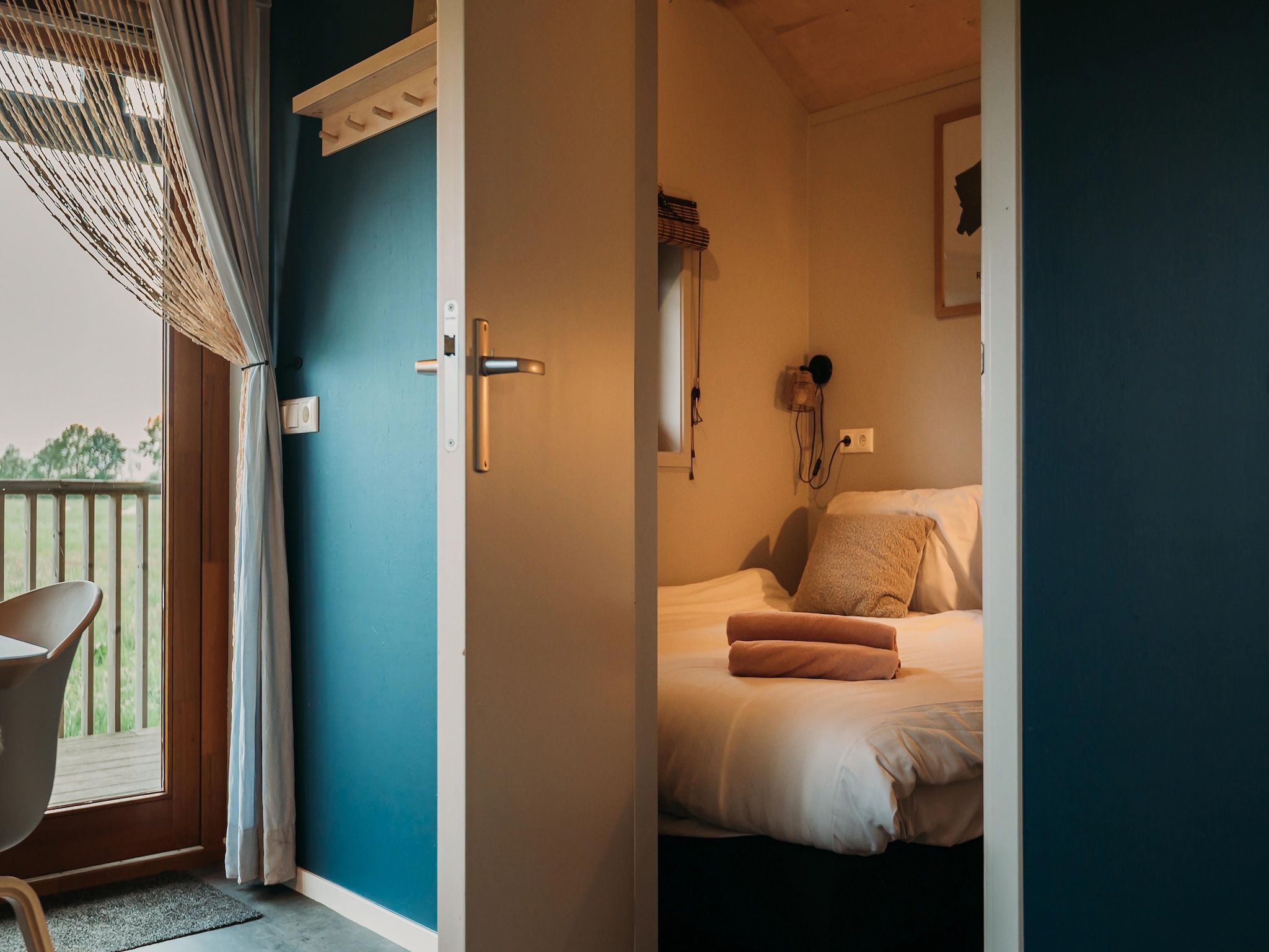 Een slaapkamer van Acker Lodges 4 in Ruinerwold