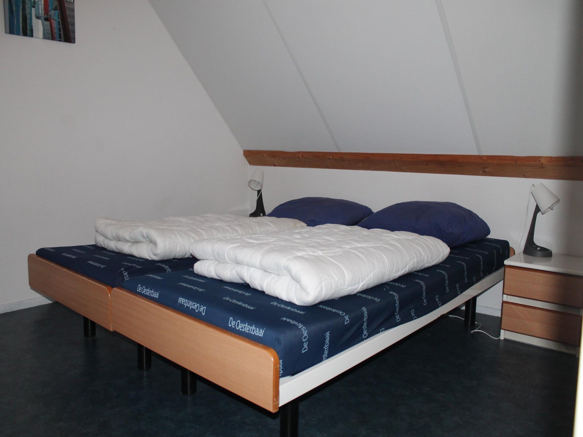 Een slaapkamer van Villapark De Oesterbaai 81 in Wemeldinge