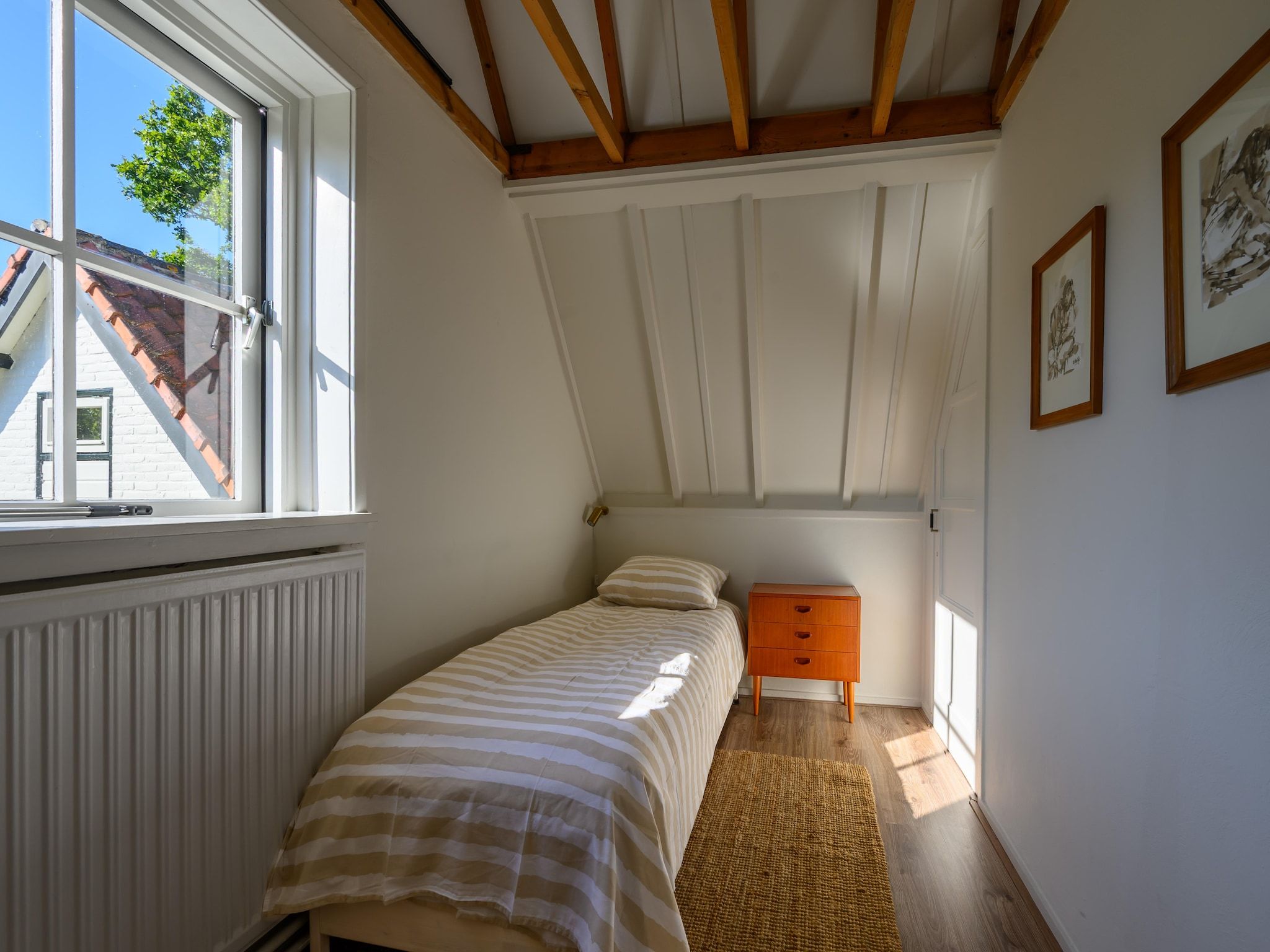 Een slaapkamer van Vakantiehuis Fijn in Bergen